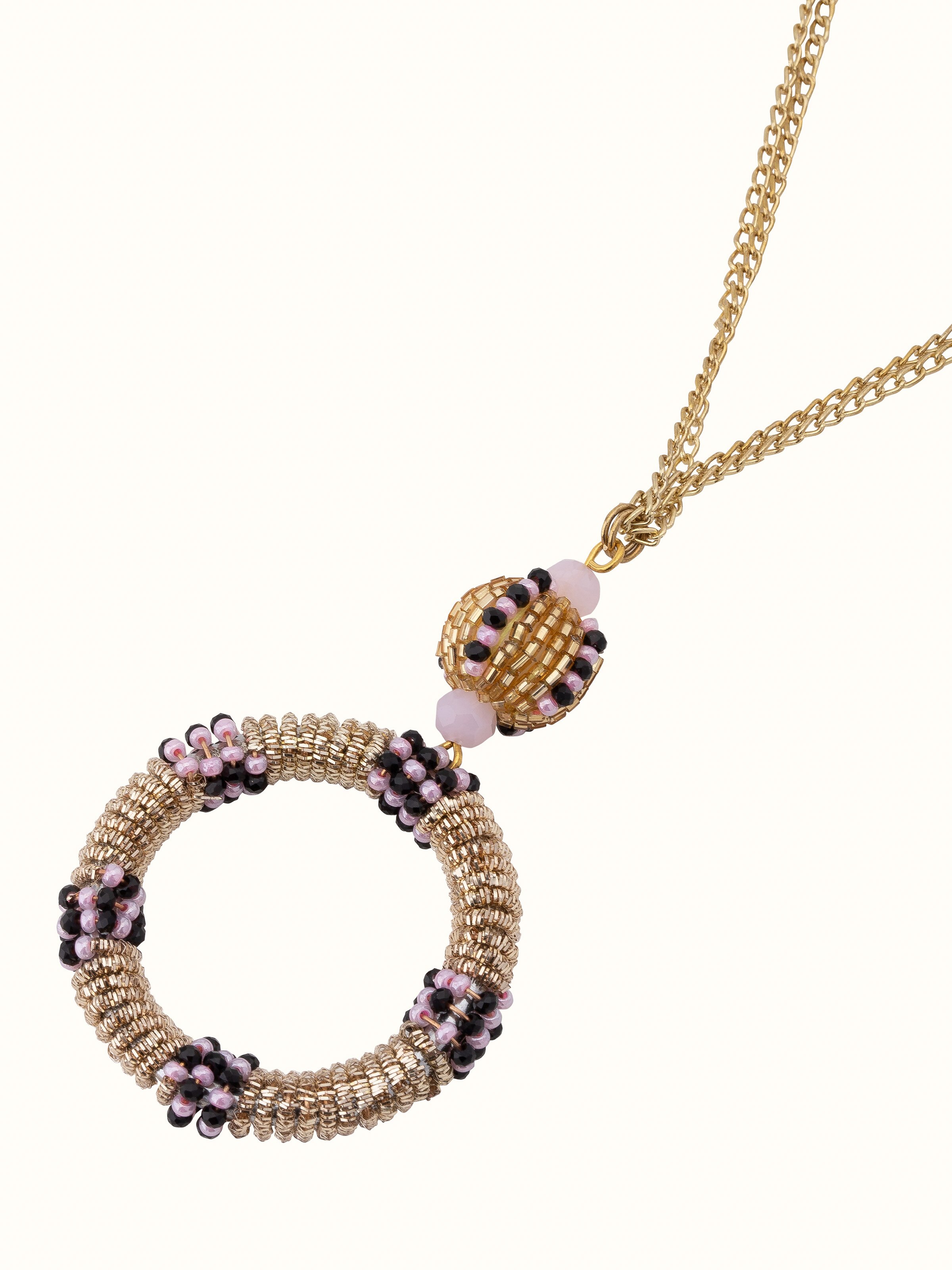 Angled view of handcrafted long necklace highlighting its elegance.