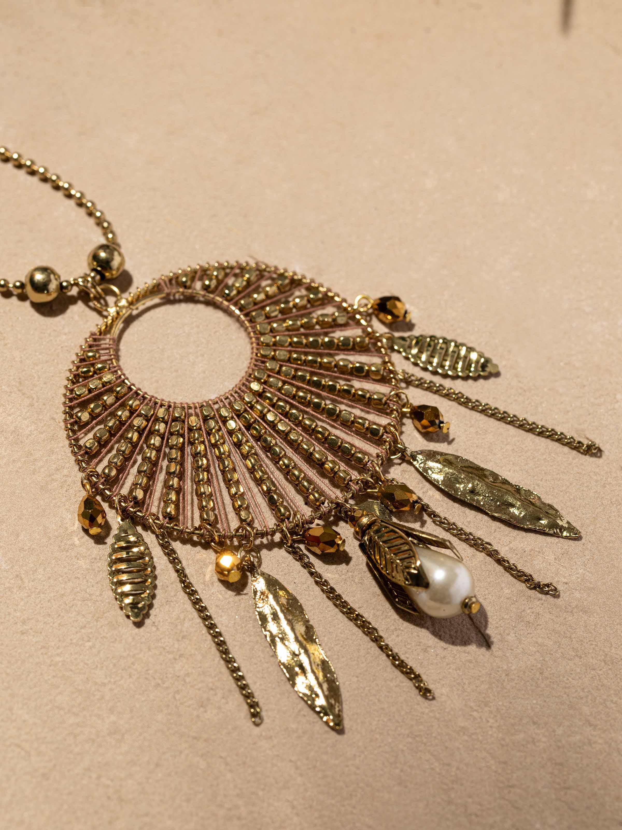 Detailed view of handcrafted long necklace’s clasp and finishing touches.