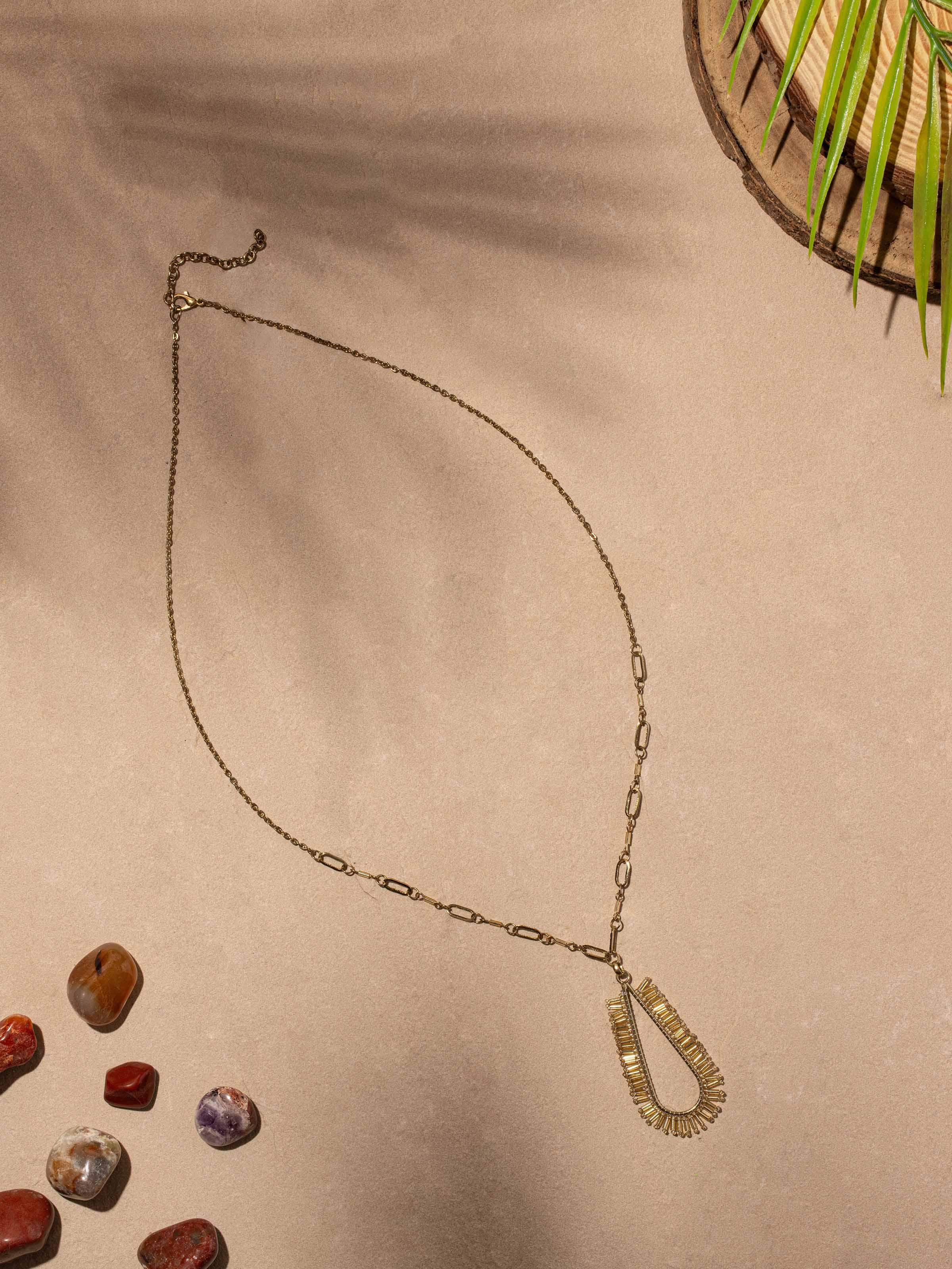 Close-up of handcrafted long necklace showcasing detailed design and craftsmanship