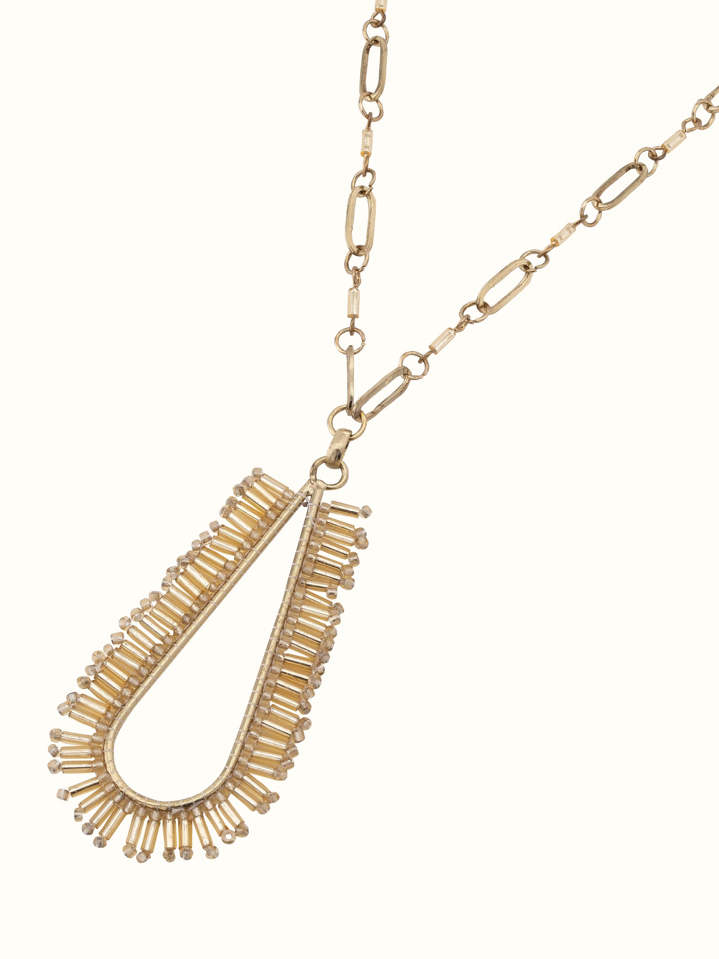 Detailed view of handcrafted long necklace emphasizing unique design elements