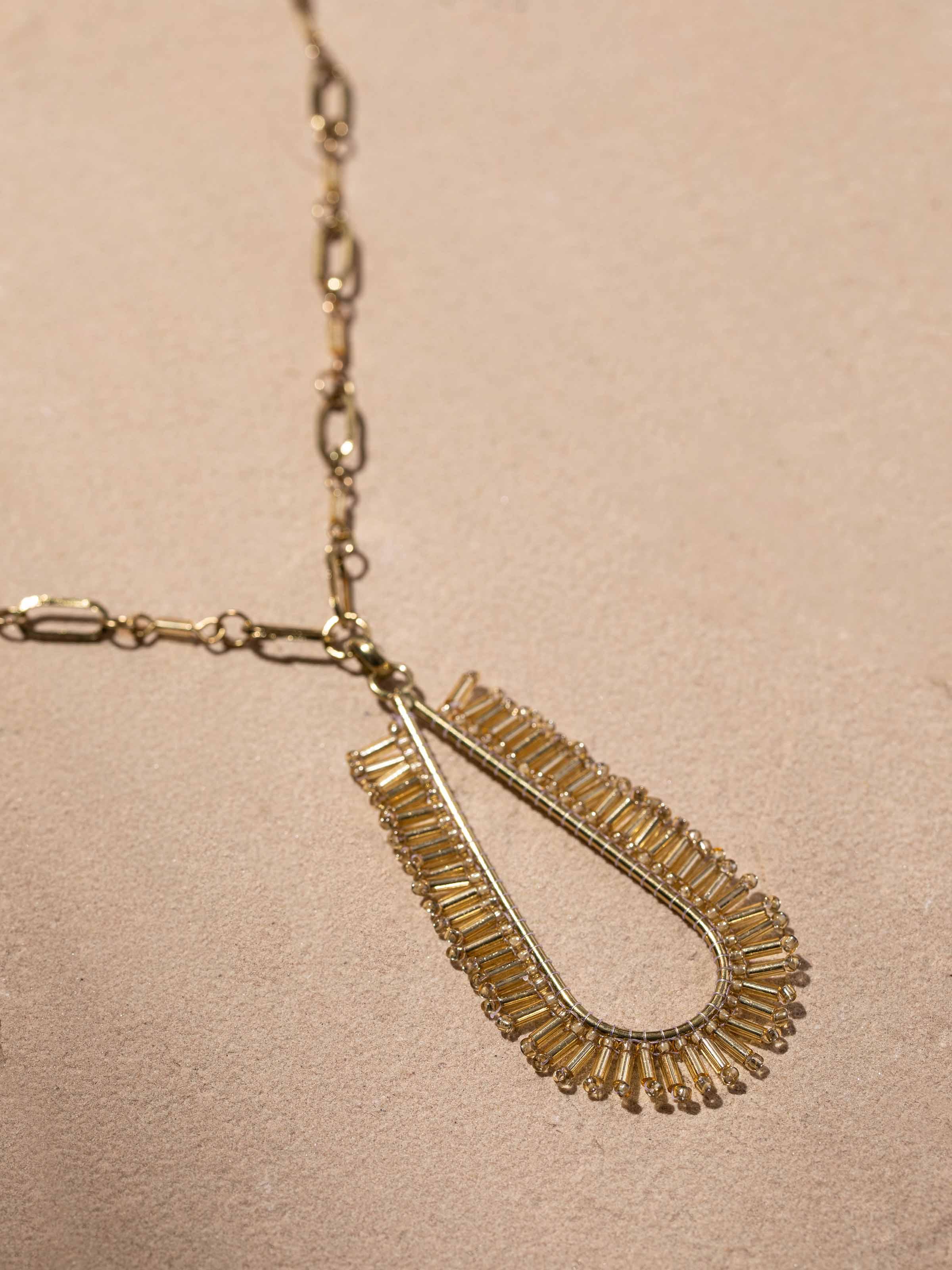 Overhead view of handcrafted long necklace highlighting overall length and elegance