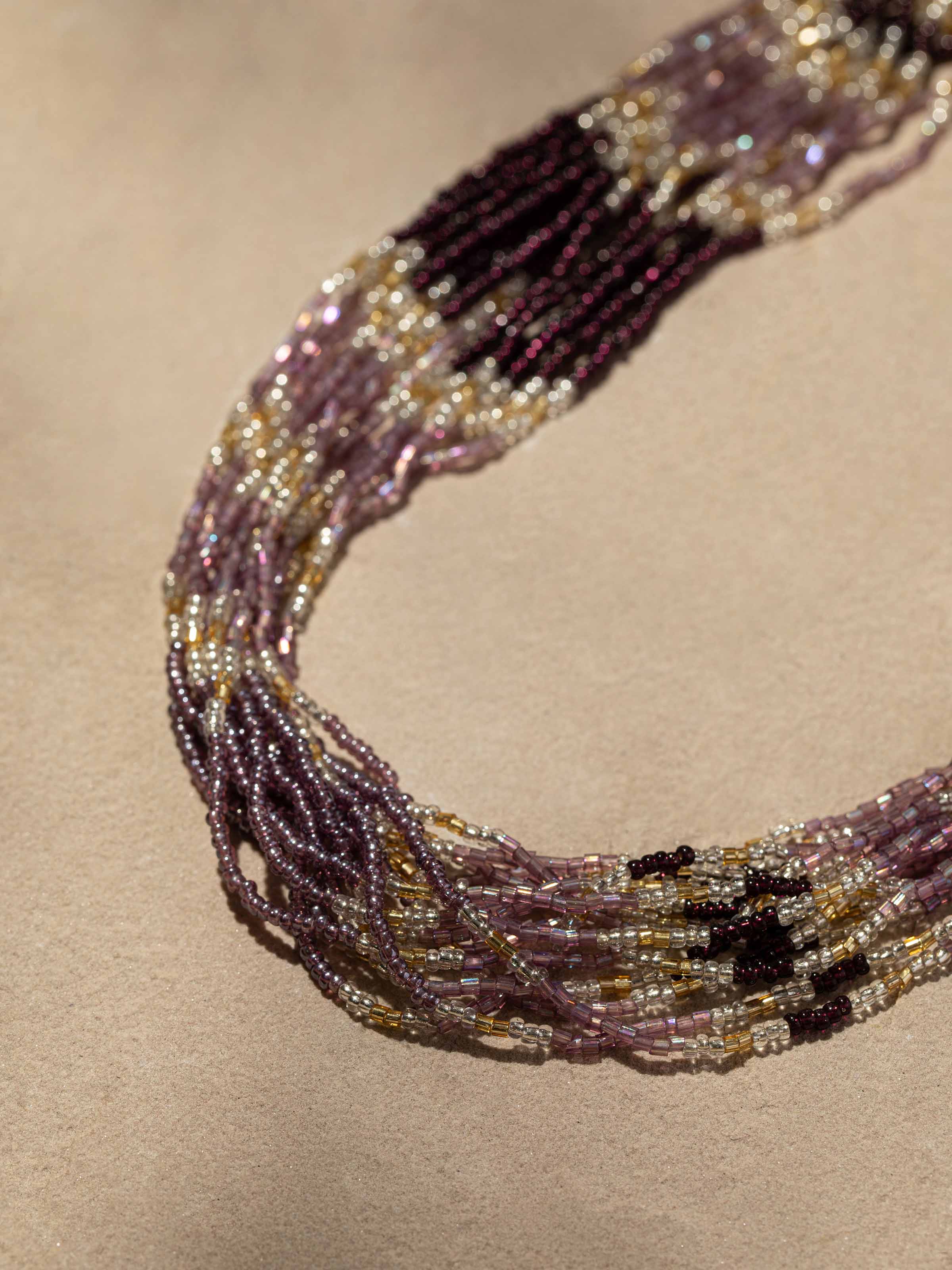 Detailed close-up of handcrafted long necklace highlighting the intricate design and finish.