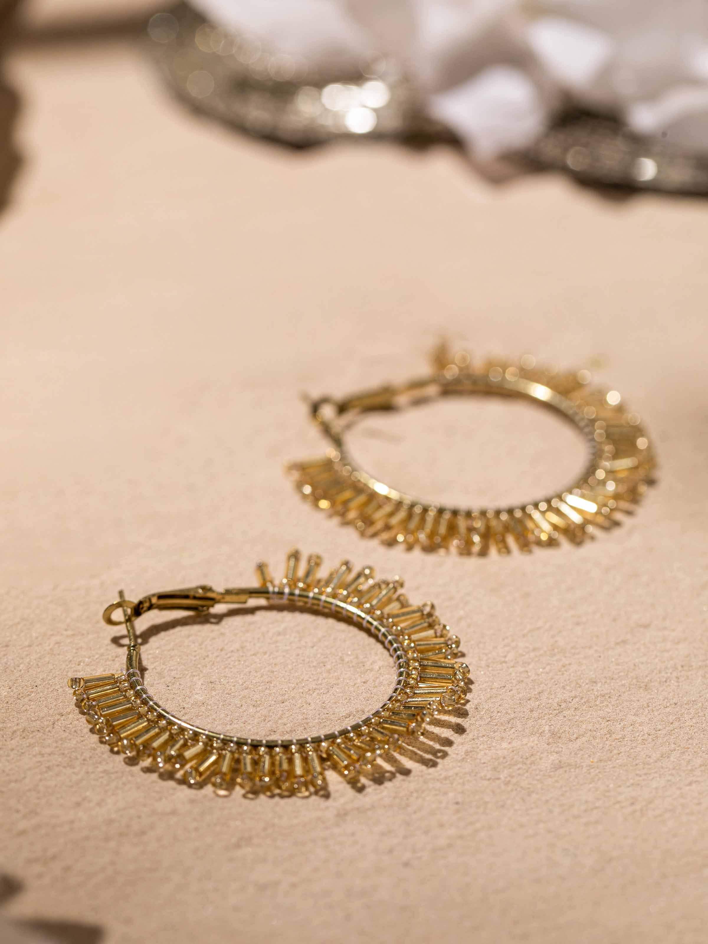Detailed close-up of Handcrafted Hoop Earrings focusing on intricate design and craftsmanship.