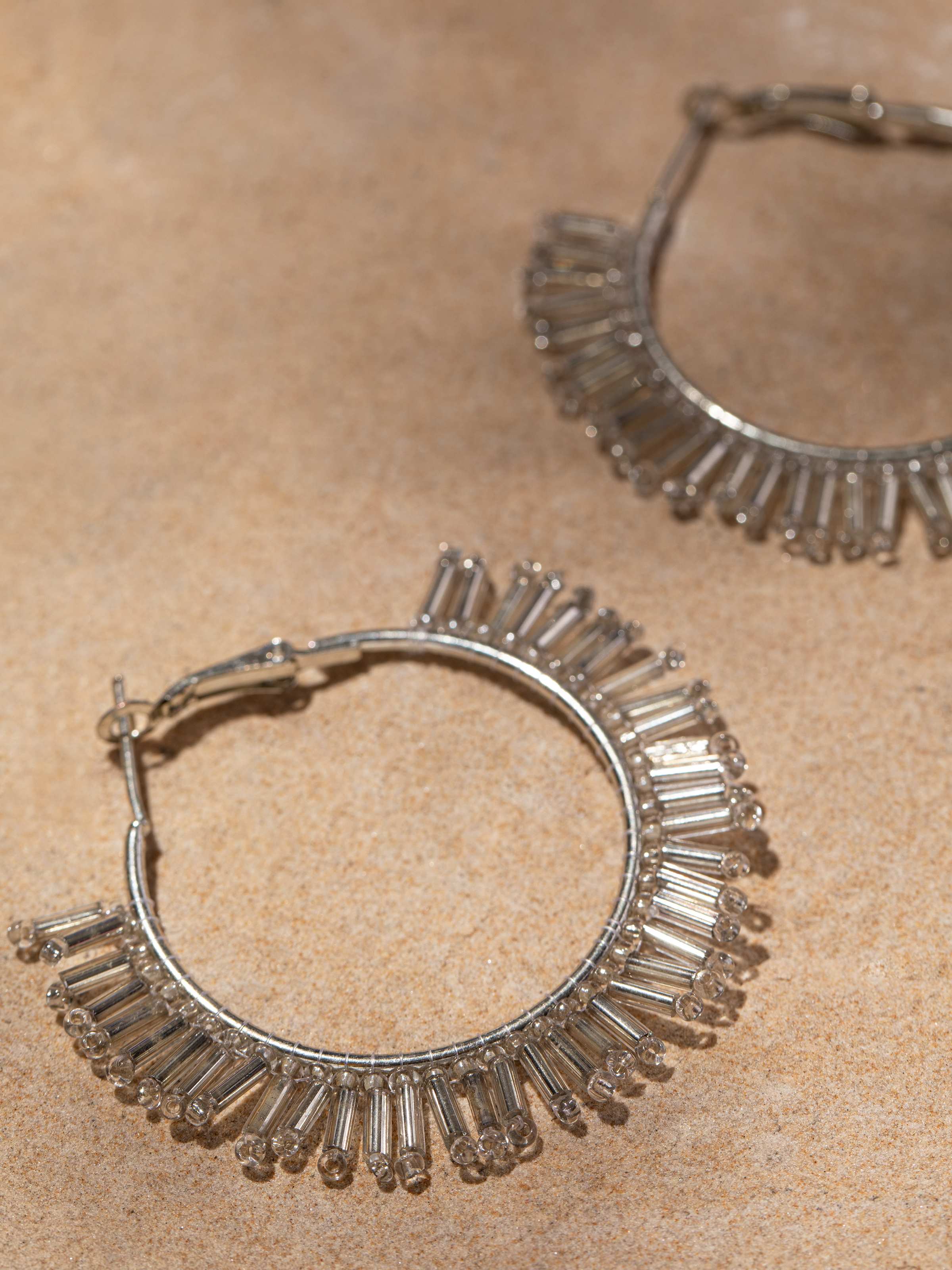Back view of handcrafted hoop earrings showing the secure clasp and overall design.