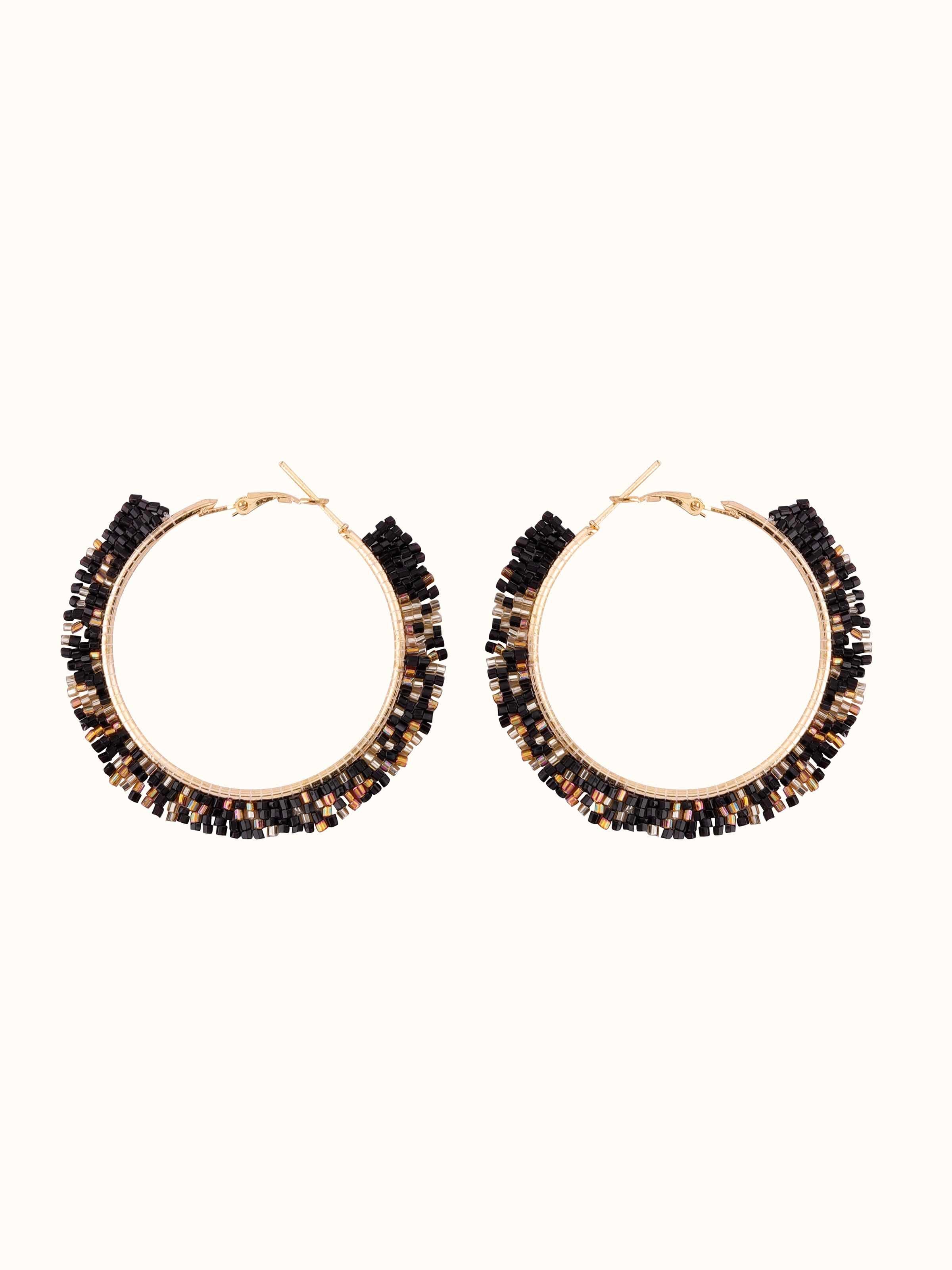 Front view of handcrafted hoop earrings with a polished finish and intricate detailing.
