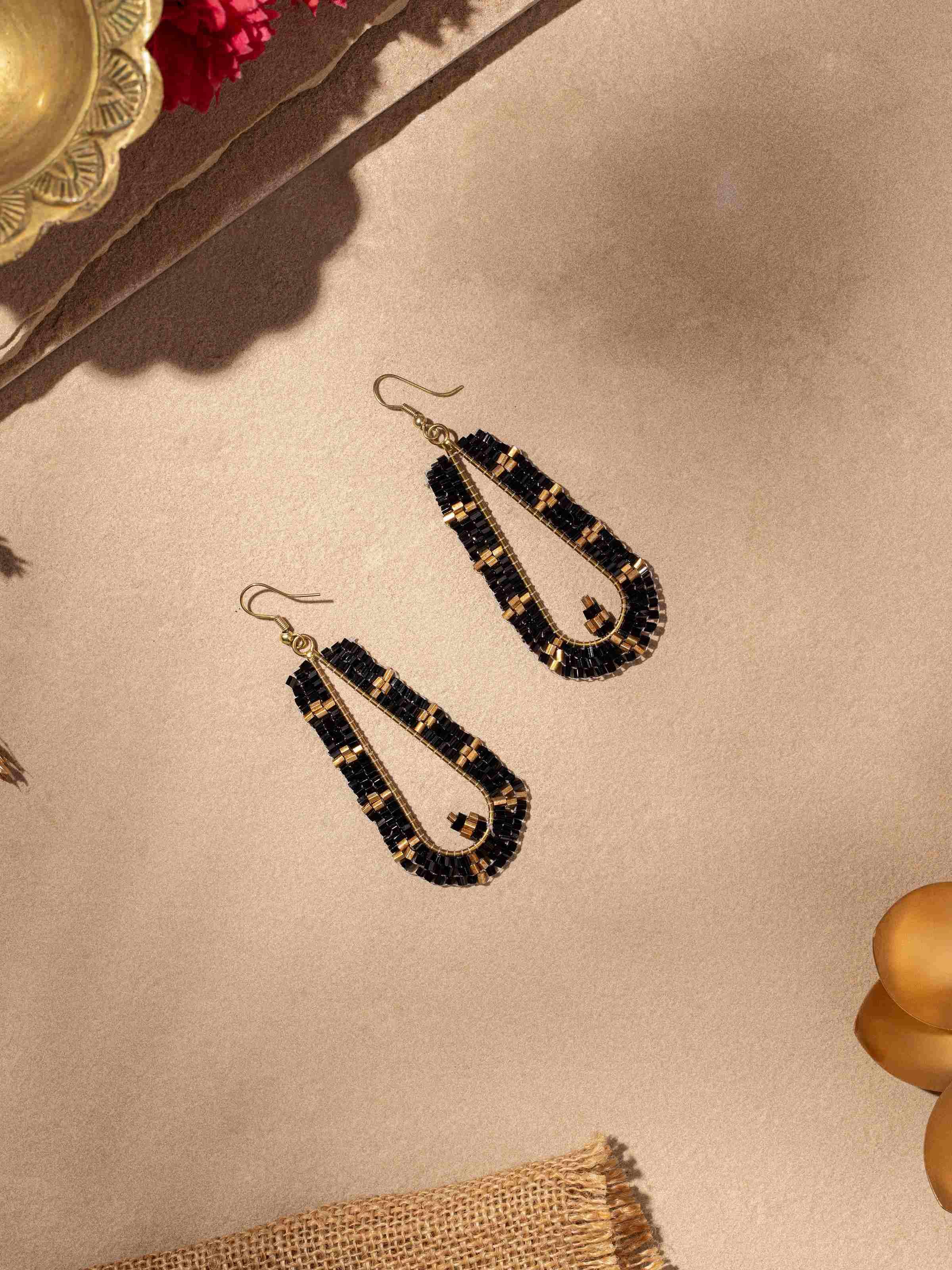 Side view of Handcrafted Drop Earrings showcasing fine detailing and artisanal work.