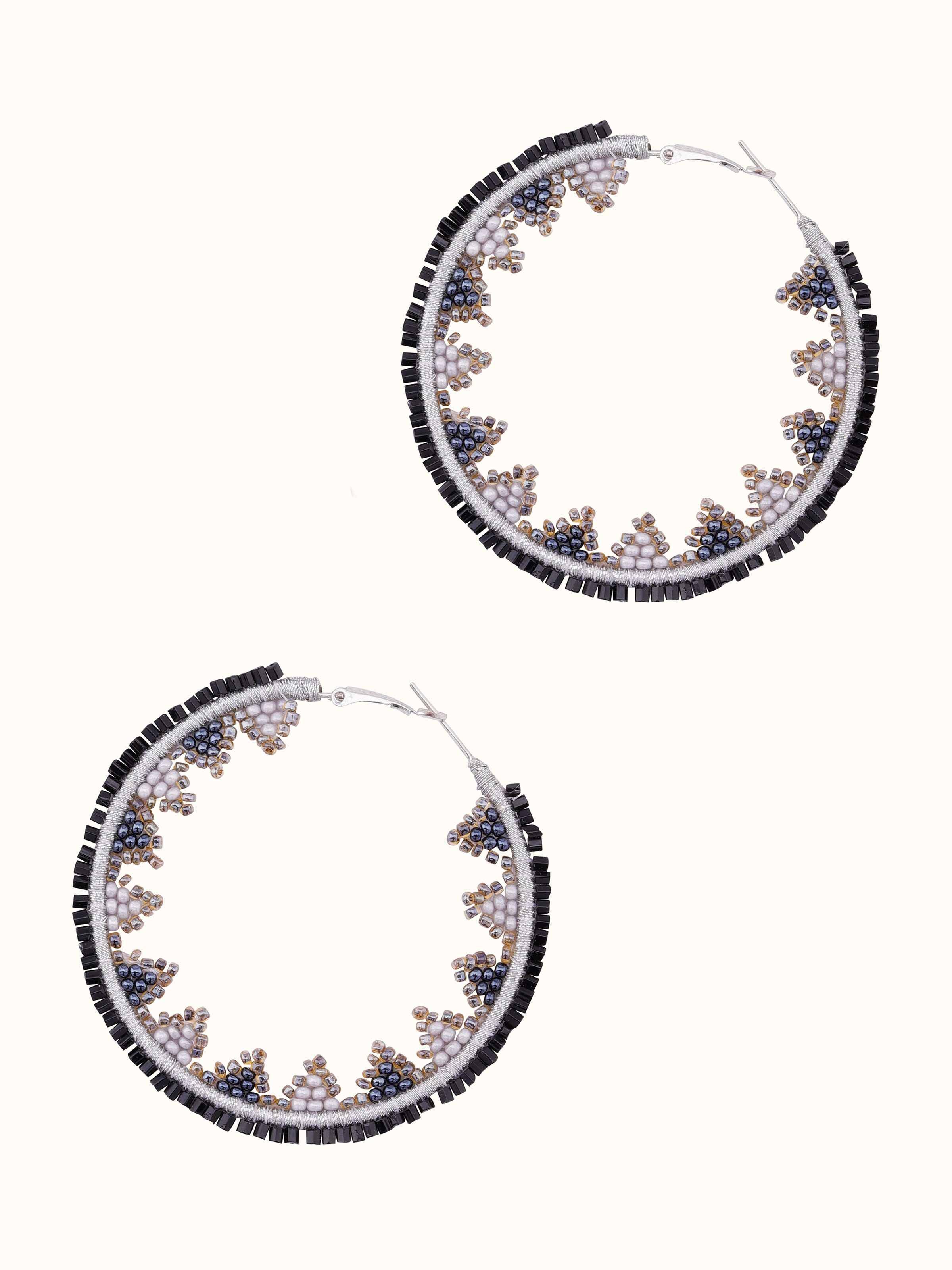Angled view of Handcrafted Hoop Earrings showcasing the elegant hoop shape and design.