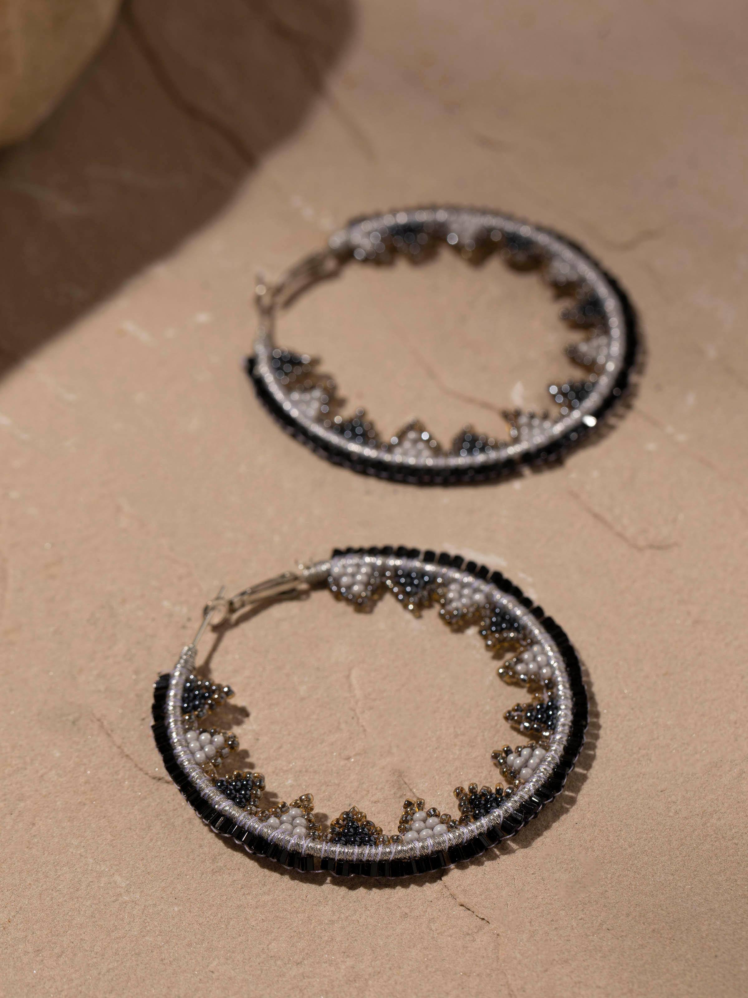 Back view of Handcrafted Hoop Earrings displaying the earring hooks and detailed design.