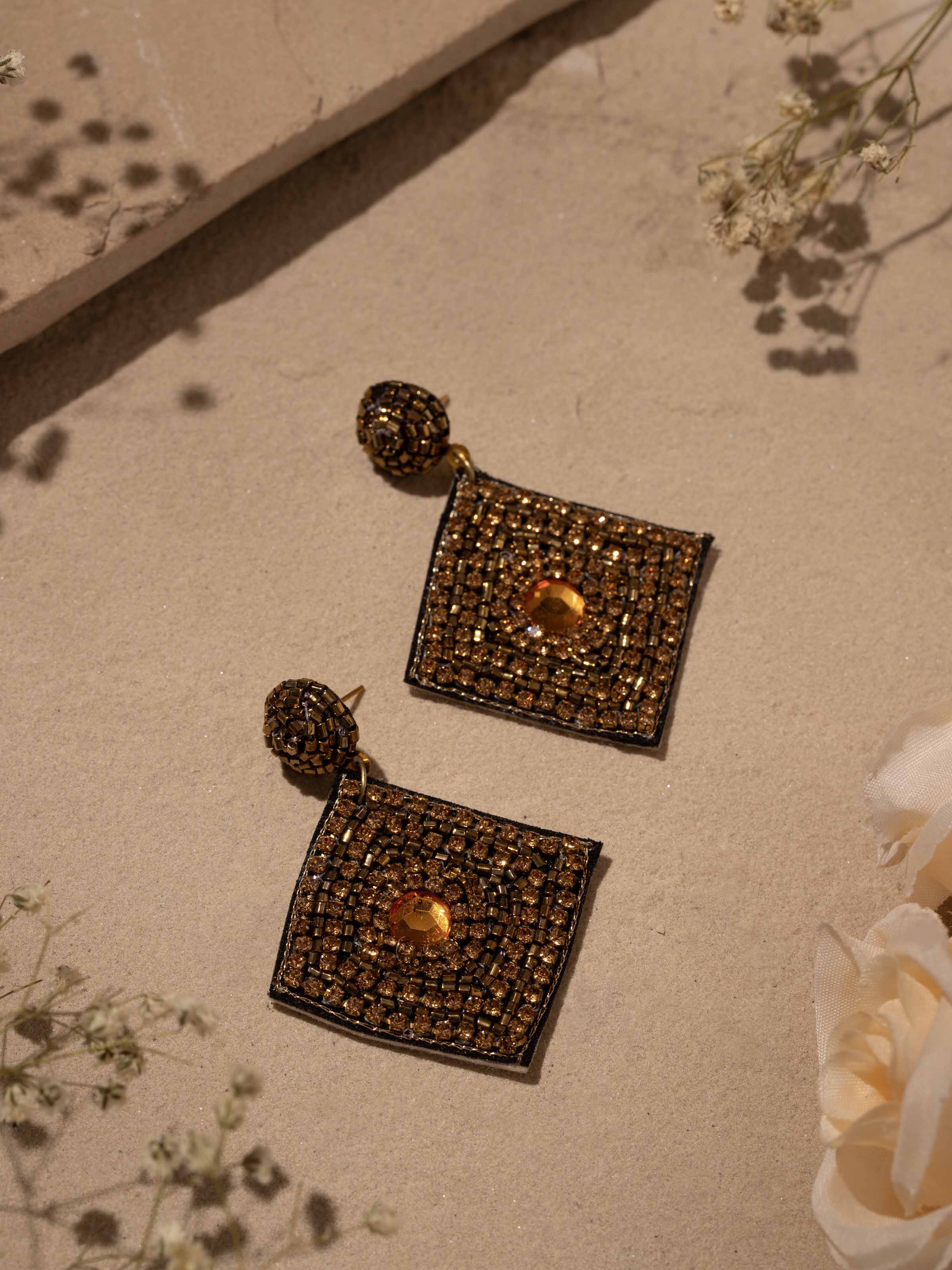 Side view of Handcrafted Drop Earrings highlighting detailed design and artisanal work.