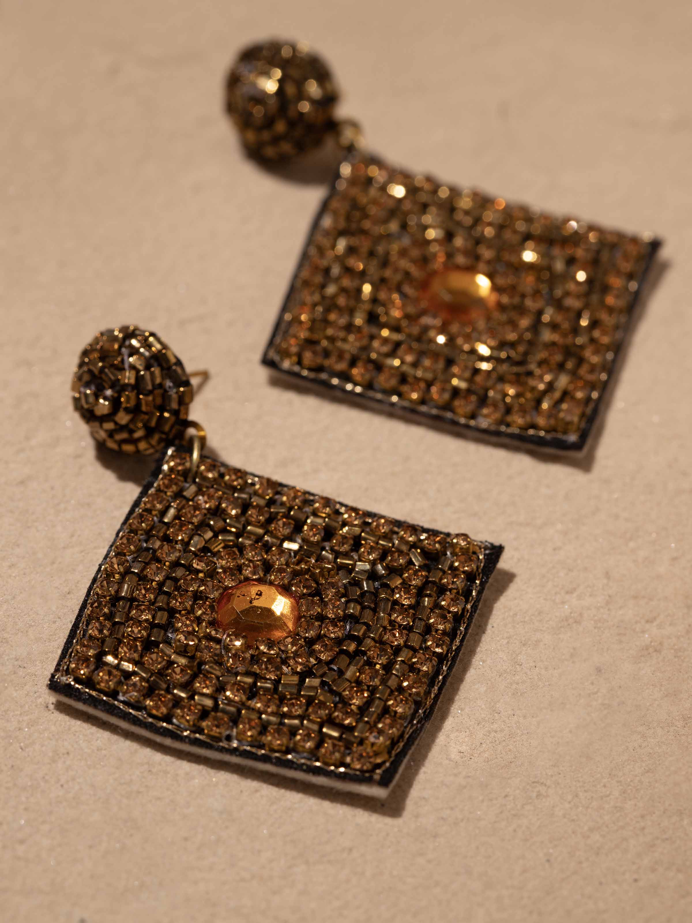 Detailed view of Handcrafted Drop Earrings from a distance, displaying full design and fine details.