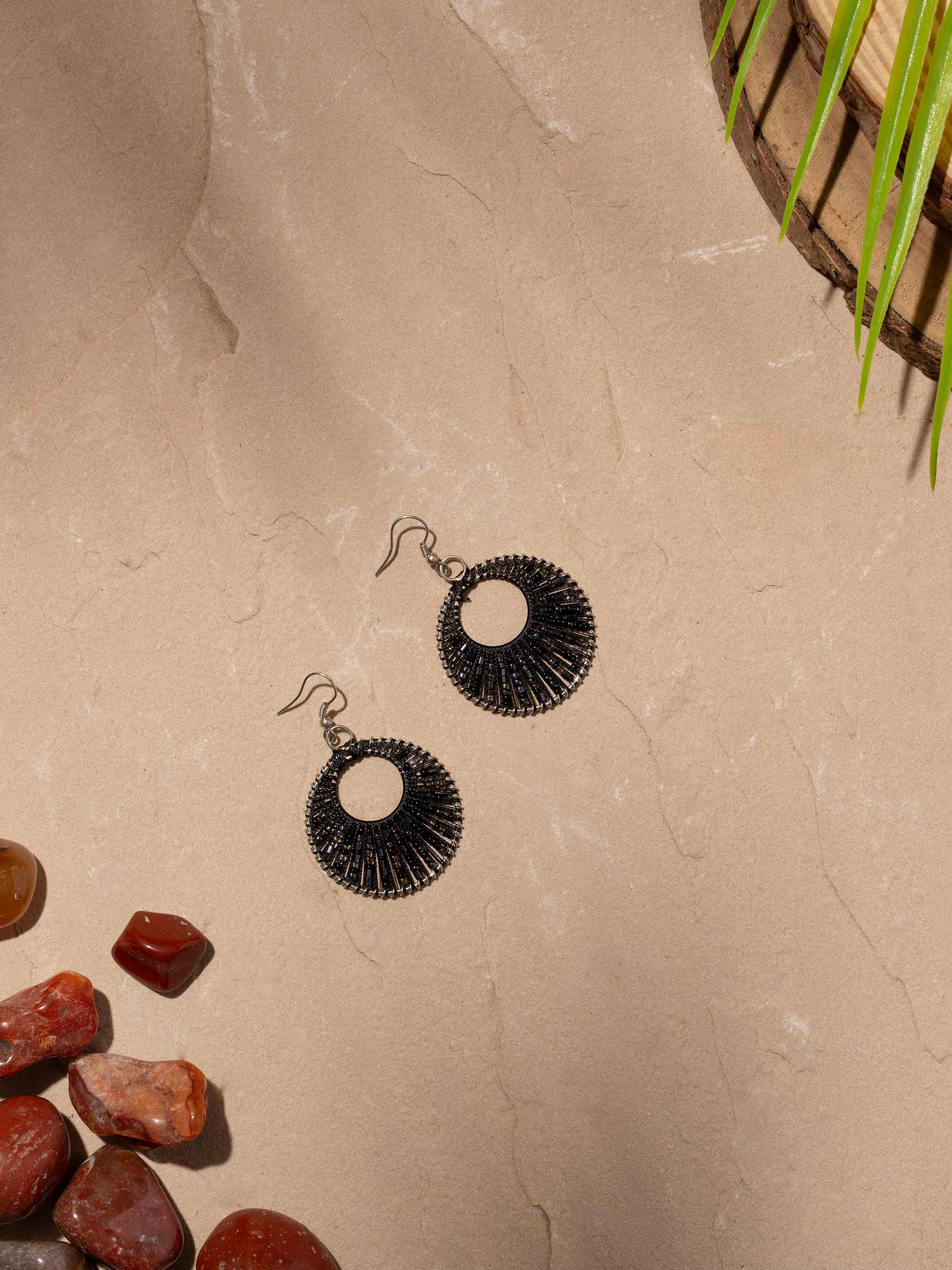 Side view of Handcrafted Drop Earrings showcasing the unique design and artisanal detailing.