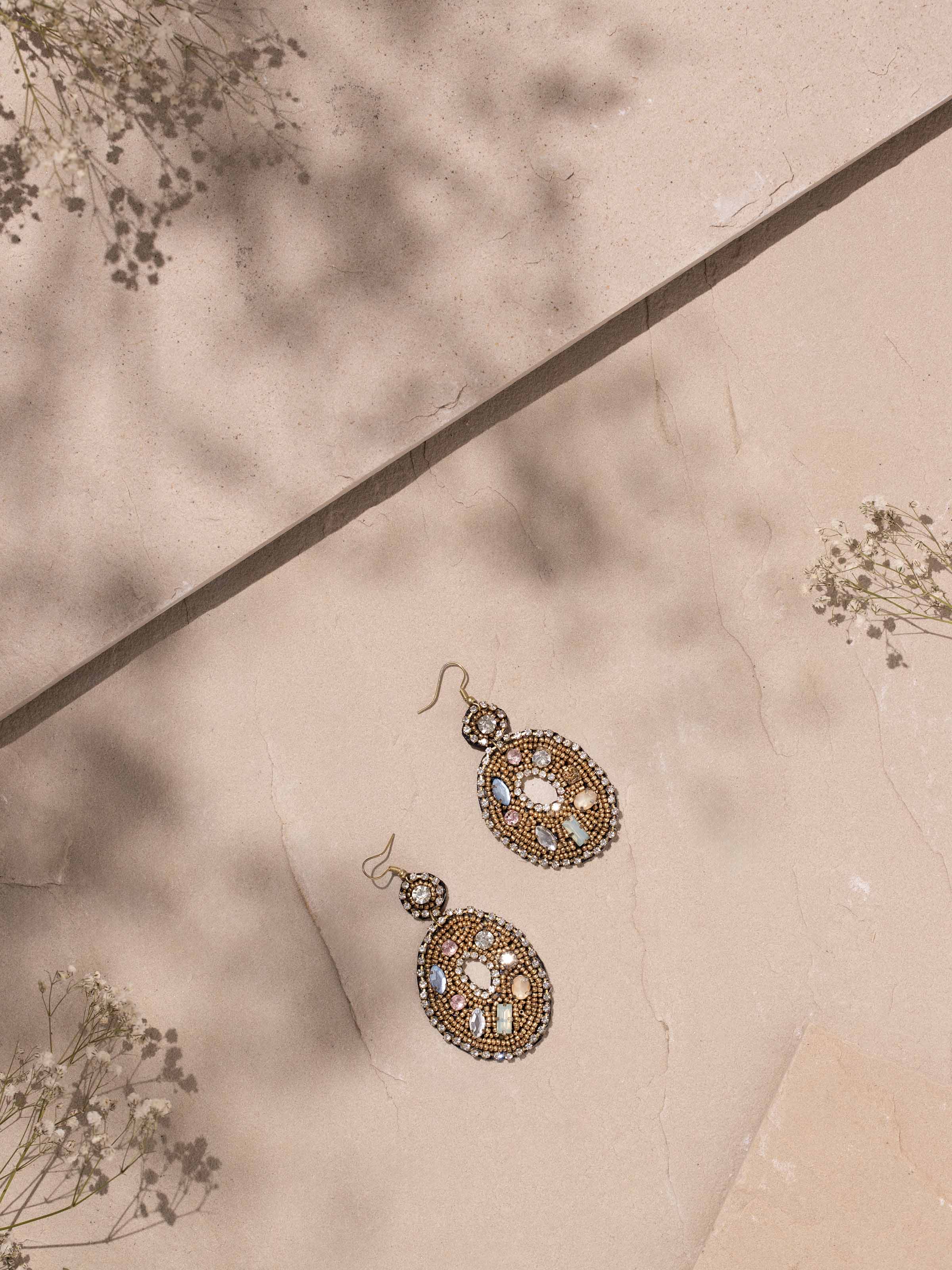 Close-up view of handcrafted drop earrings highlighting their delicate detailing
