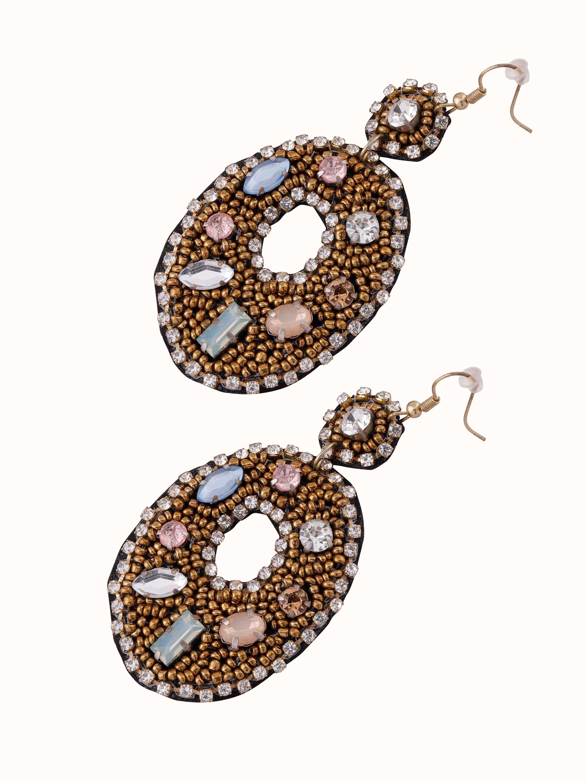 Angled view of handcrafted drop earrings emphasizing their unique design and craftsmanship