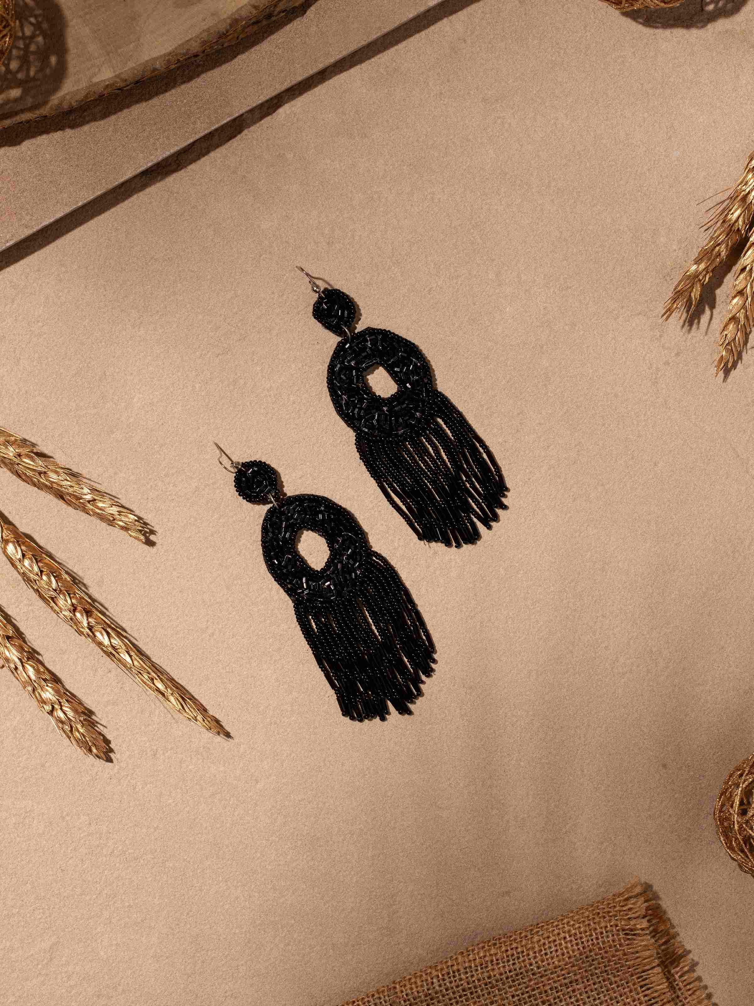 Side view of Handcrafted drop earrings highlighting their elegant design and artistic details