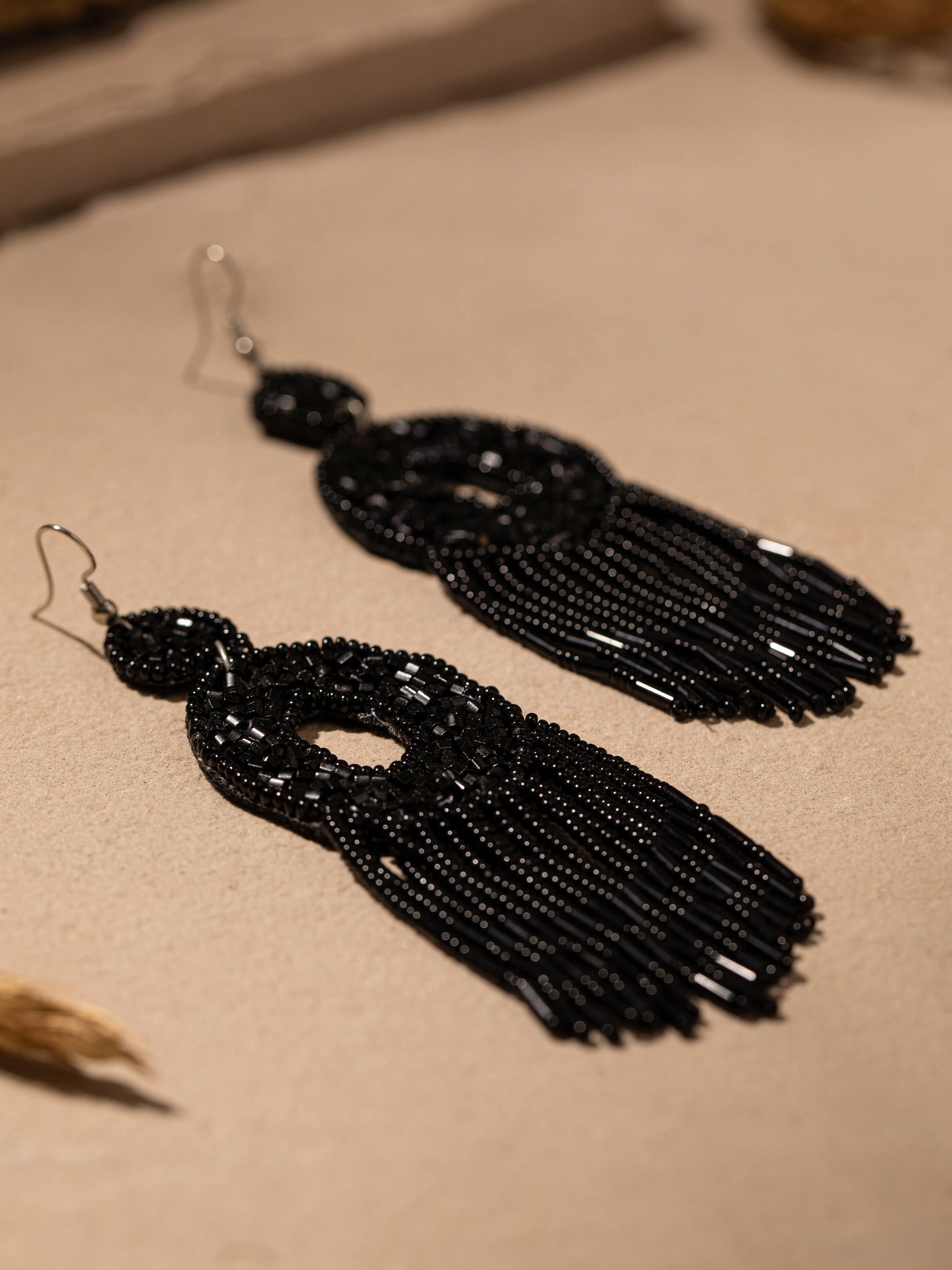 Detailed front view of Handcrafted drop earrings highlighting their elegant design and artisanal quality