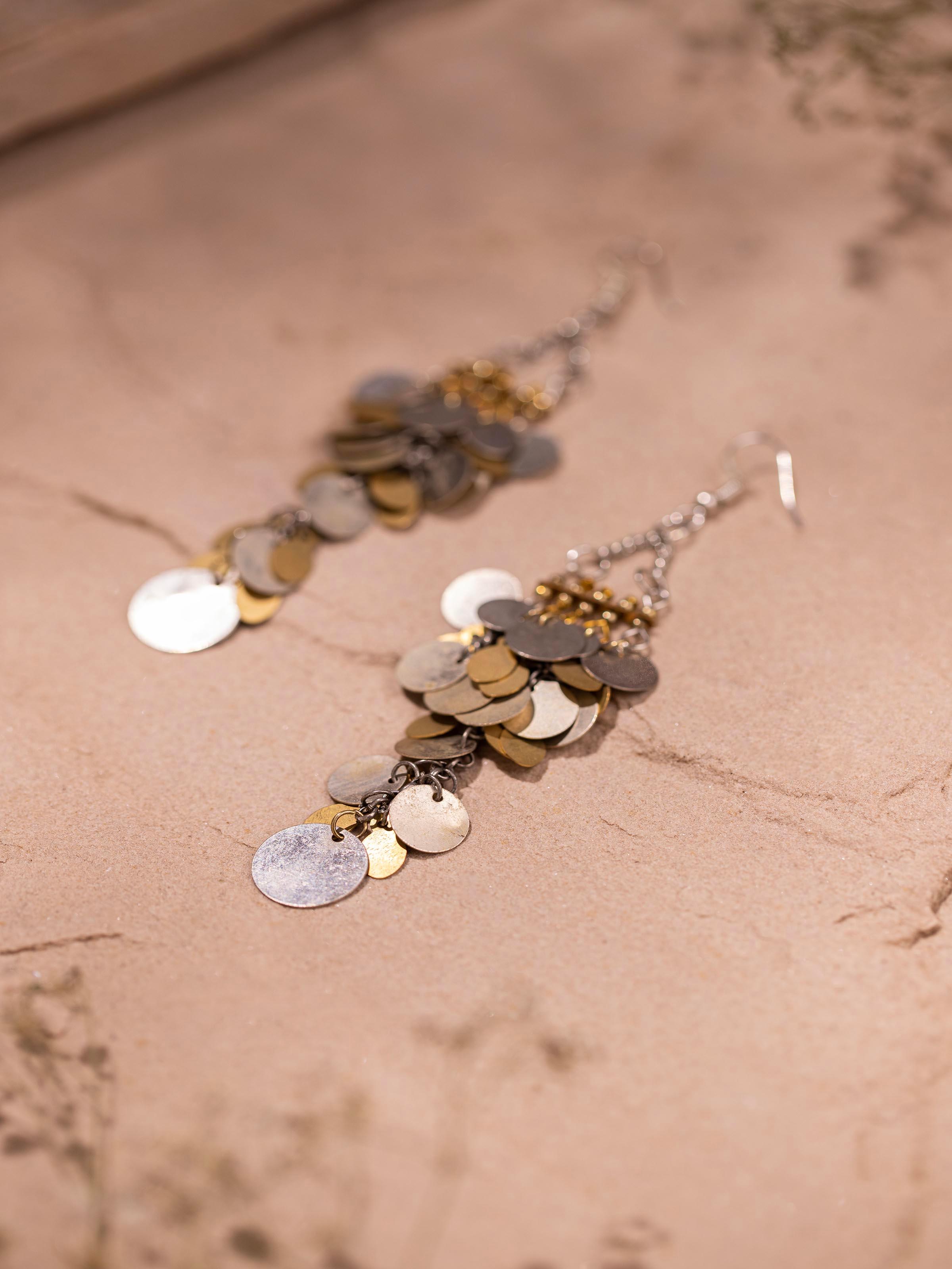 Back view of handcrafted drop earrings showing the secure clasp and overall design.