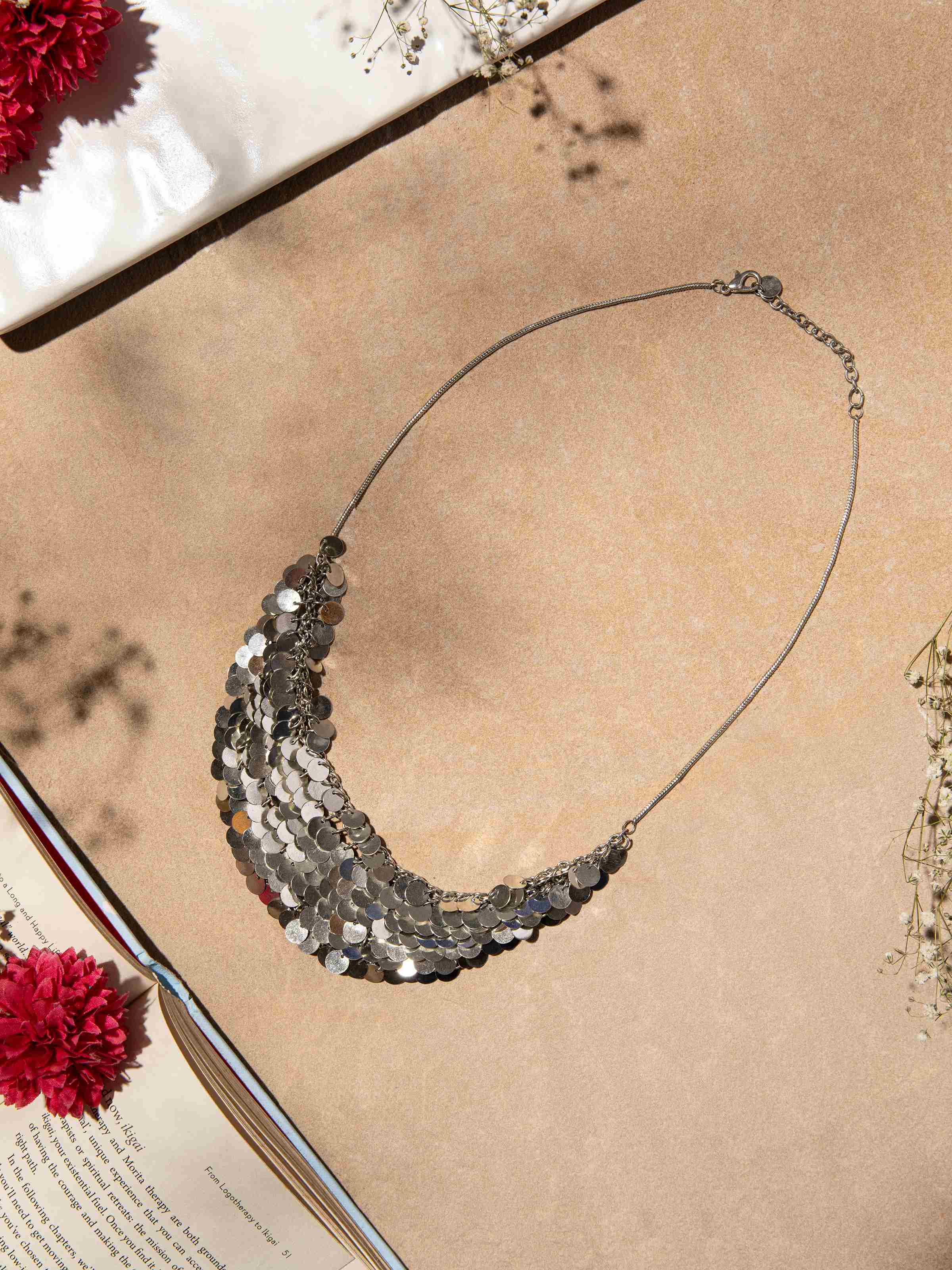 Side view of Silver Smithing Drop Earrings showcasing their detailed craftsmanship.