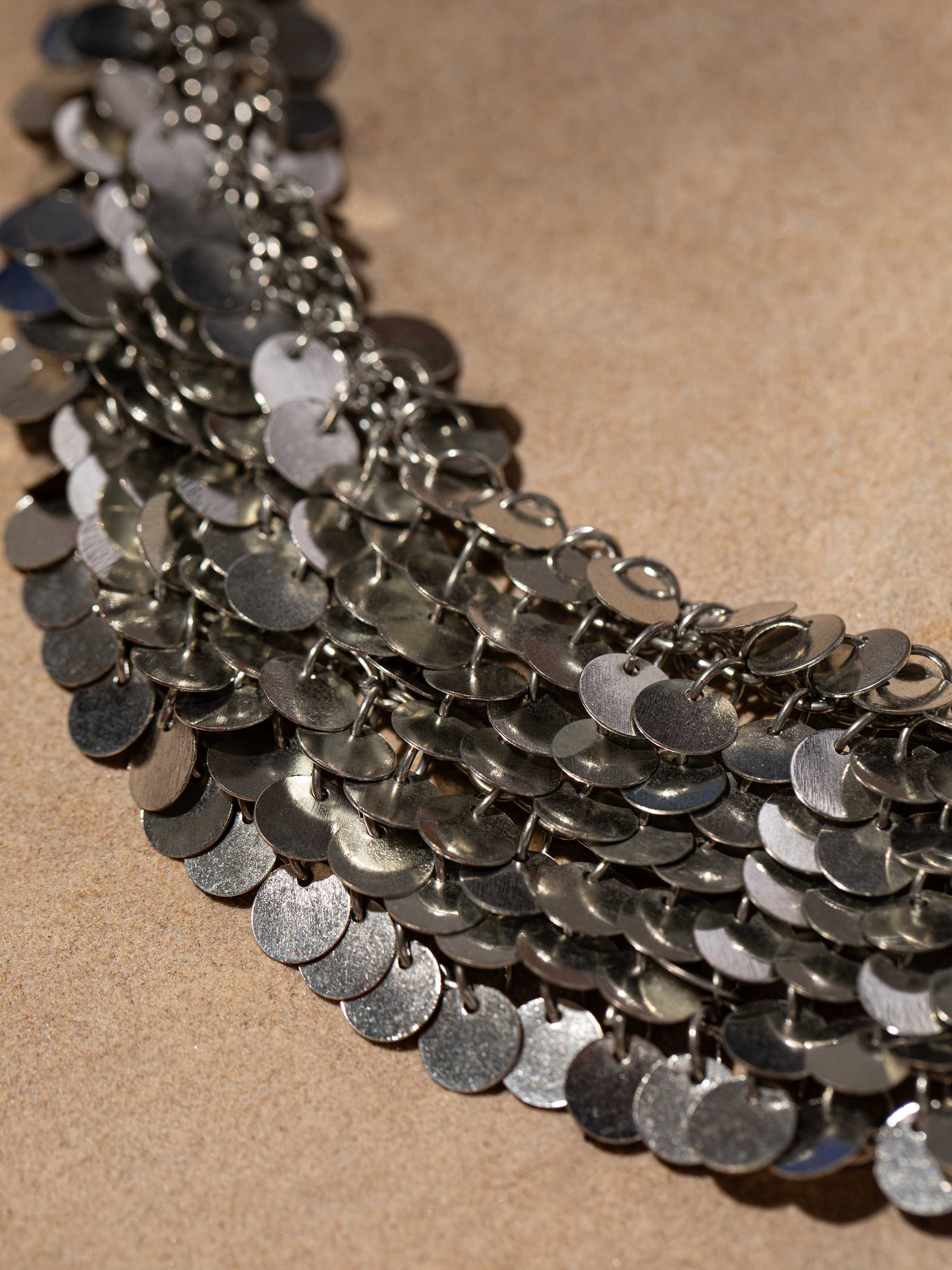 Side view of Handcrafted Drop Earrings with emphasis on detailed metalwork.