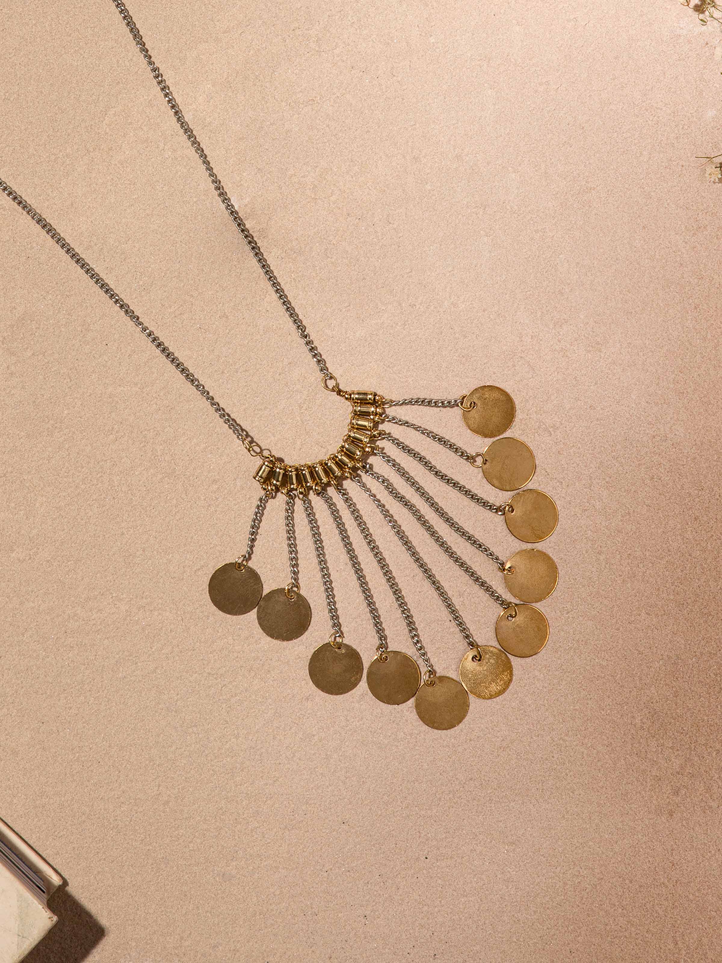 Detailed front view of handcrafted long necklace showing its artistic design and texture