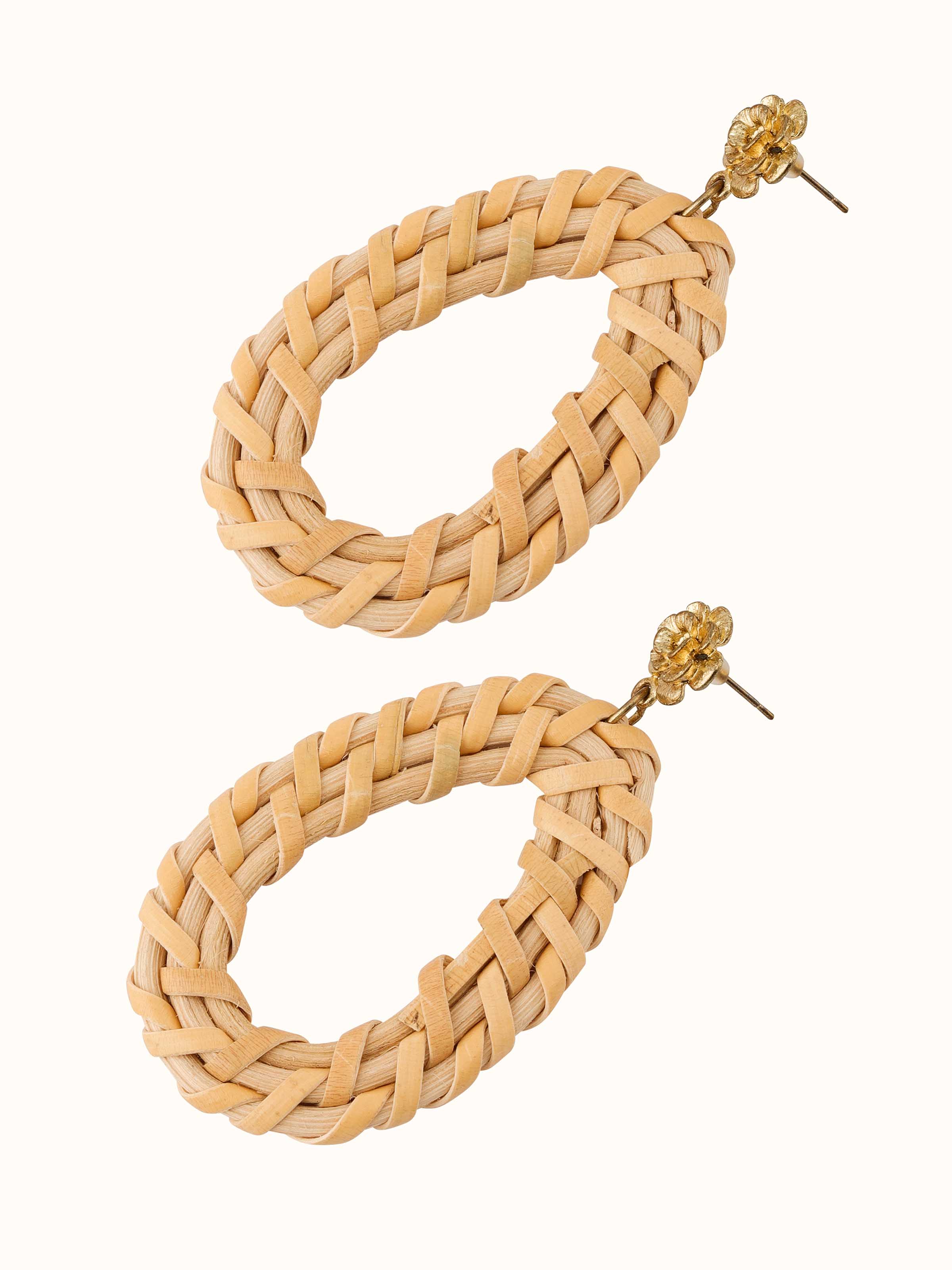 Angled view of handcrafted stud earrings focusing on intricate design and fine craftsmanship