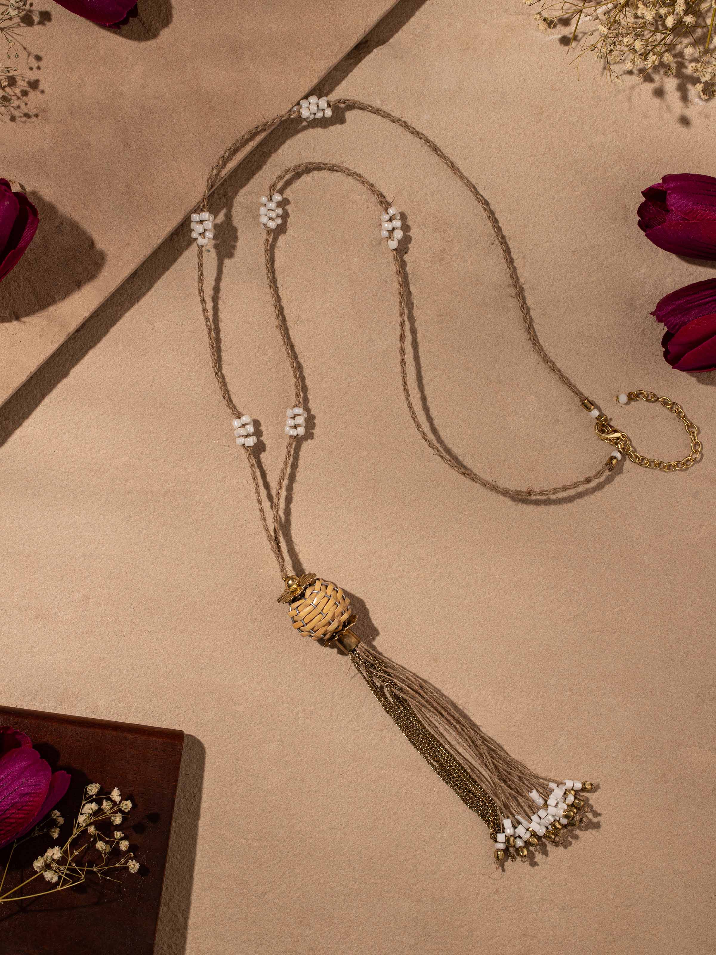 Close-up of handcrafted long necklace emphasizing intricate bead patterns