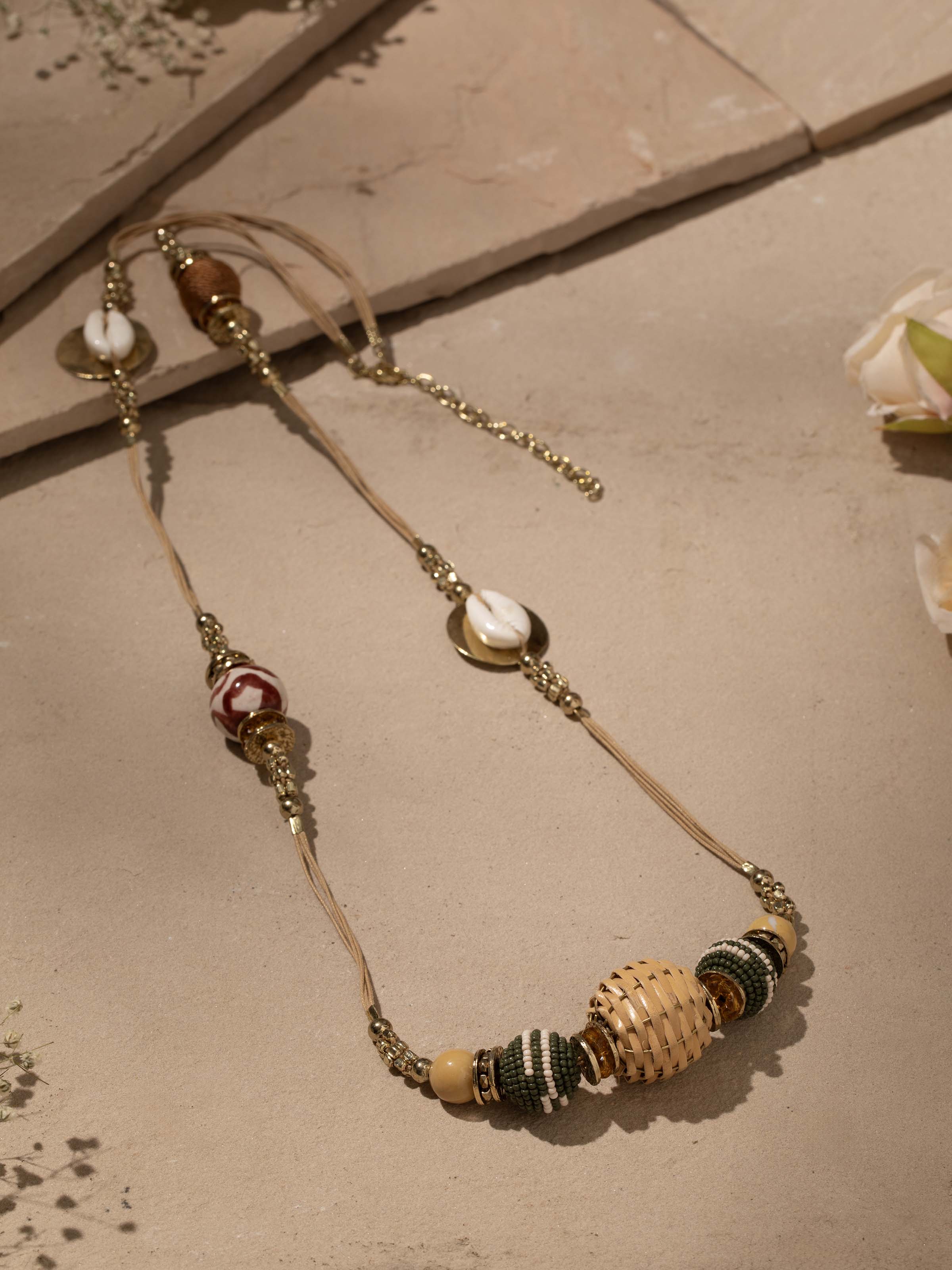 Side view of Handcrafted Long Necklace showcasing intricate design and elements.