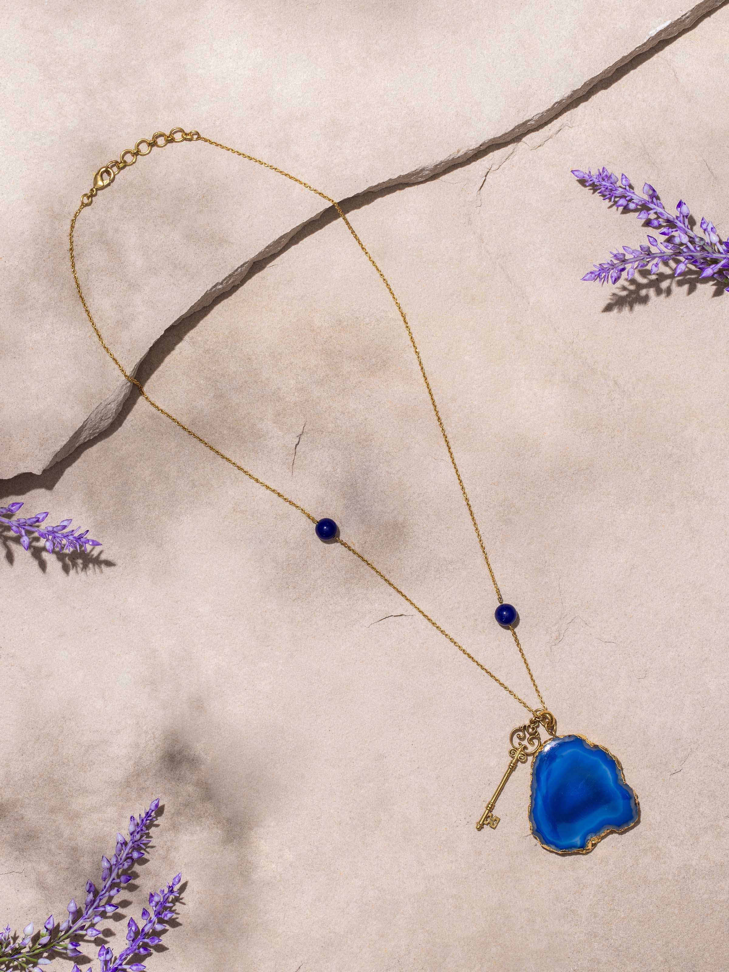 Side view of Agate Pendant with Chain showing the elegant pendant shape and smooth agate surface.