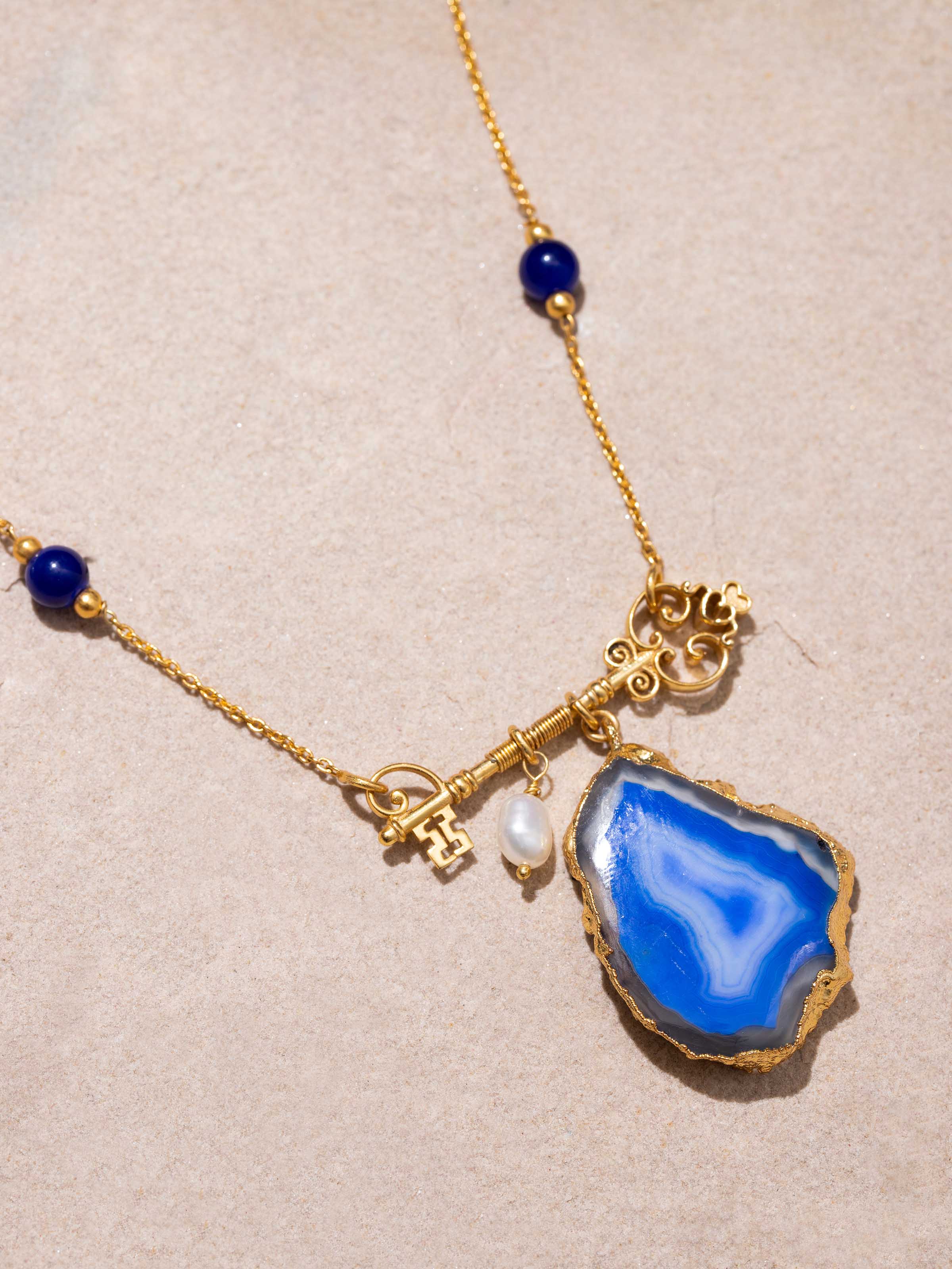 Angled view of Agate Long Necklace showcasing the rich colors and natural beauty of agate stones.