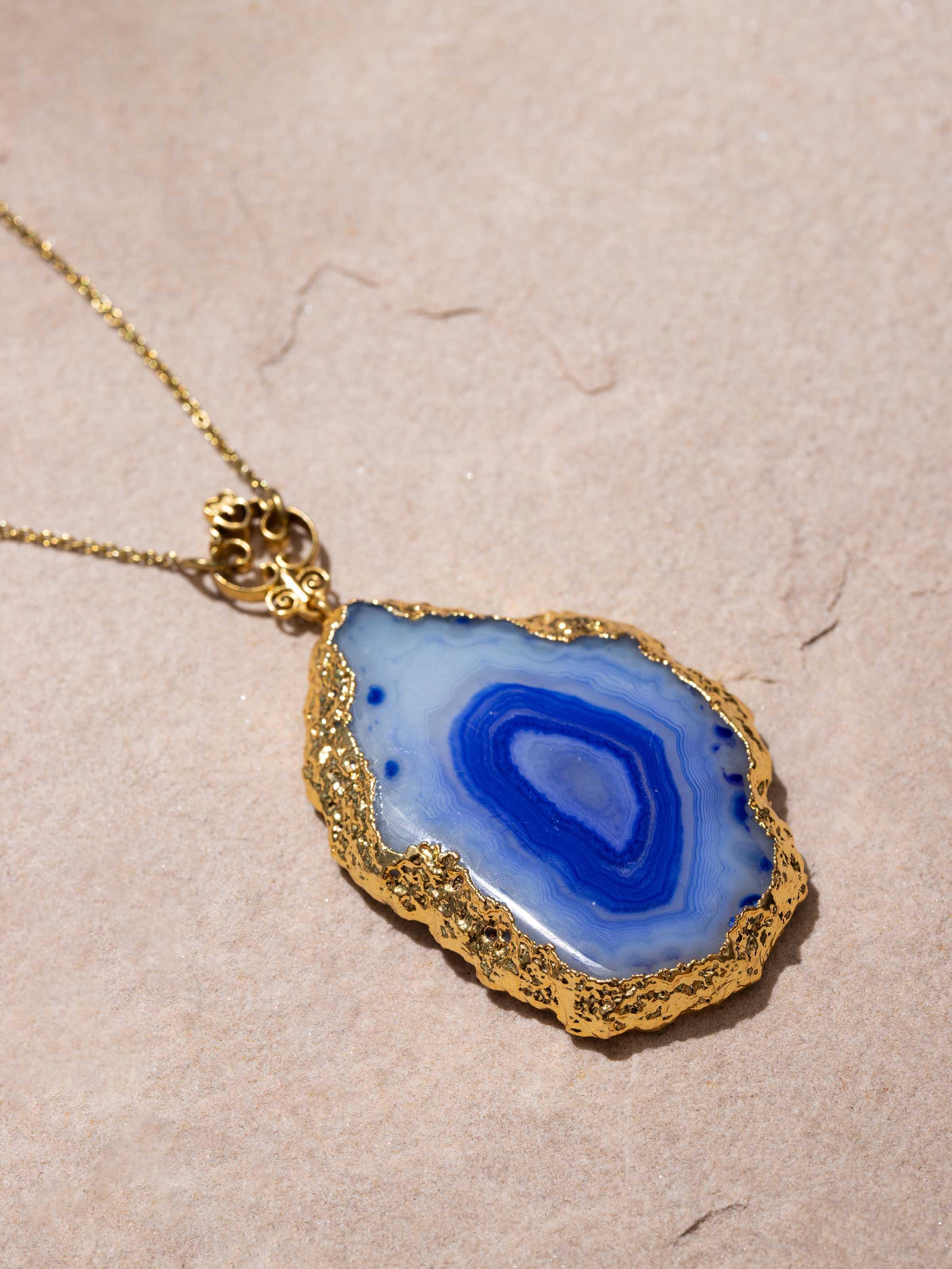 Back view of agate pendant with chain displaying the secure clasp.