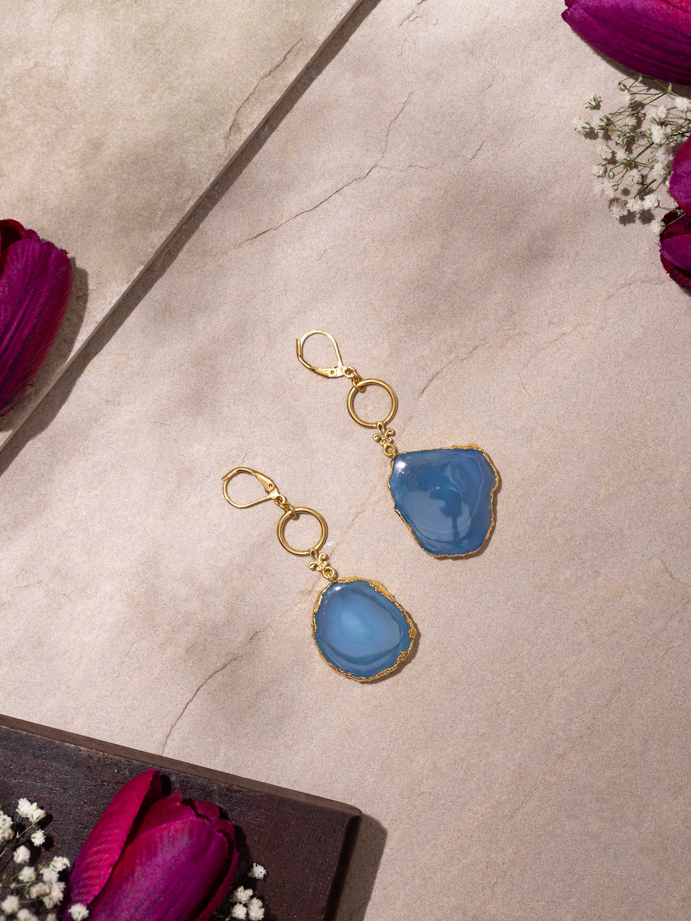 Side view of agate drop earrings displaying the stone's color and setting