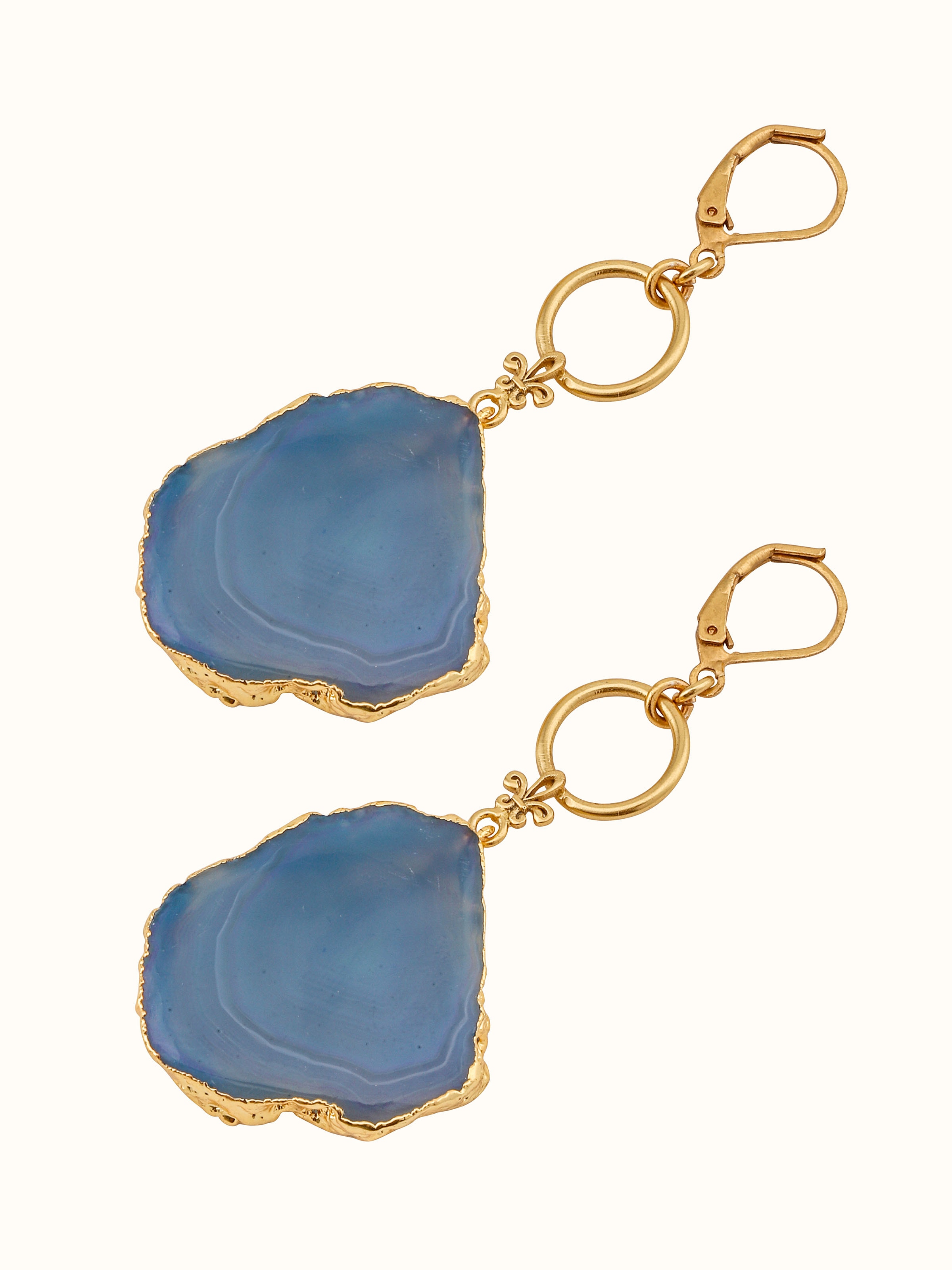 Angled view of agate drop earrings highlighting the unique facets and style
