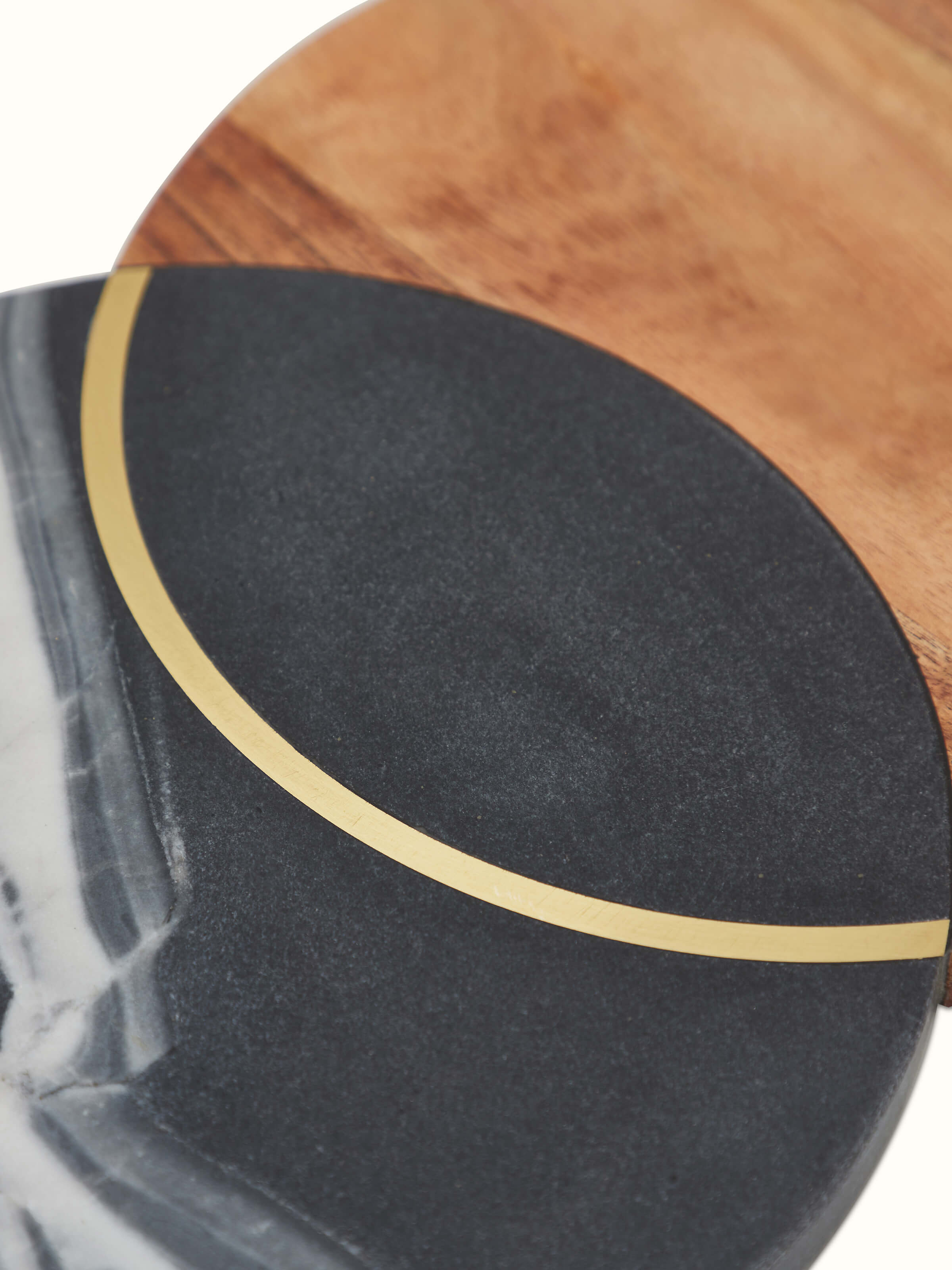 Marble and acacia wood cheese board with a focus on the craftsmanship and natural textures of the materials.