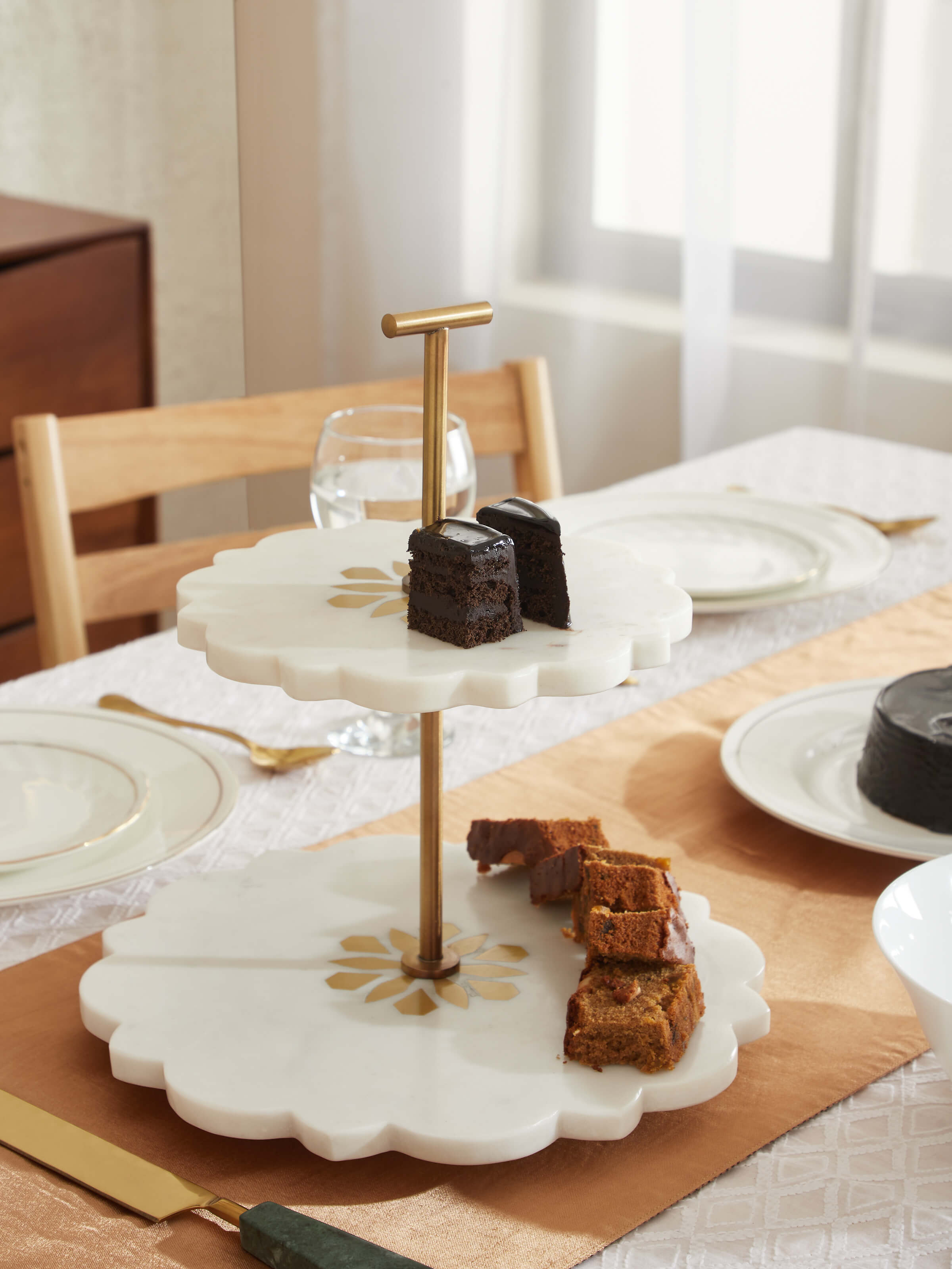 Side view of Marble & Brass 2-tier cake stand highlighting its sophisticated design and tiered structure