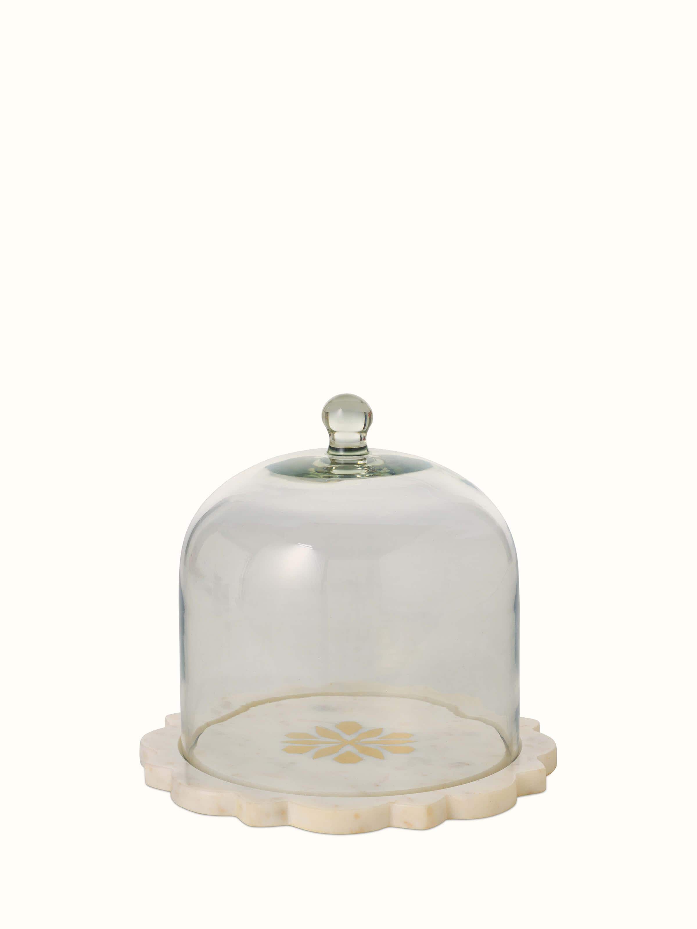 Front view of carved marble and glass cloche displaying elegant craftsmanship