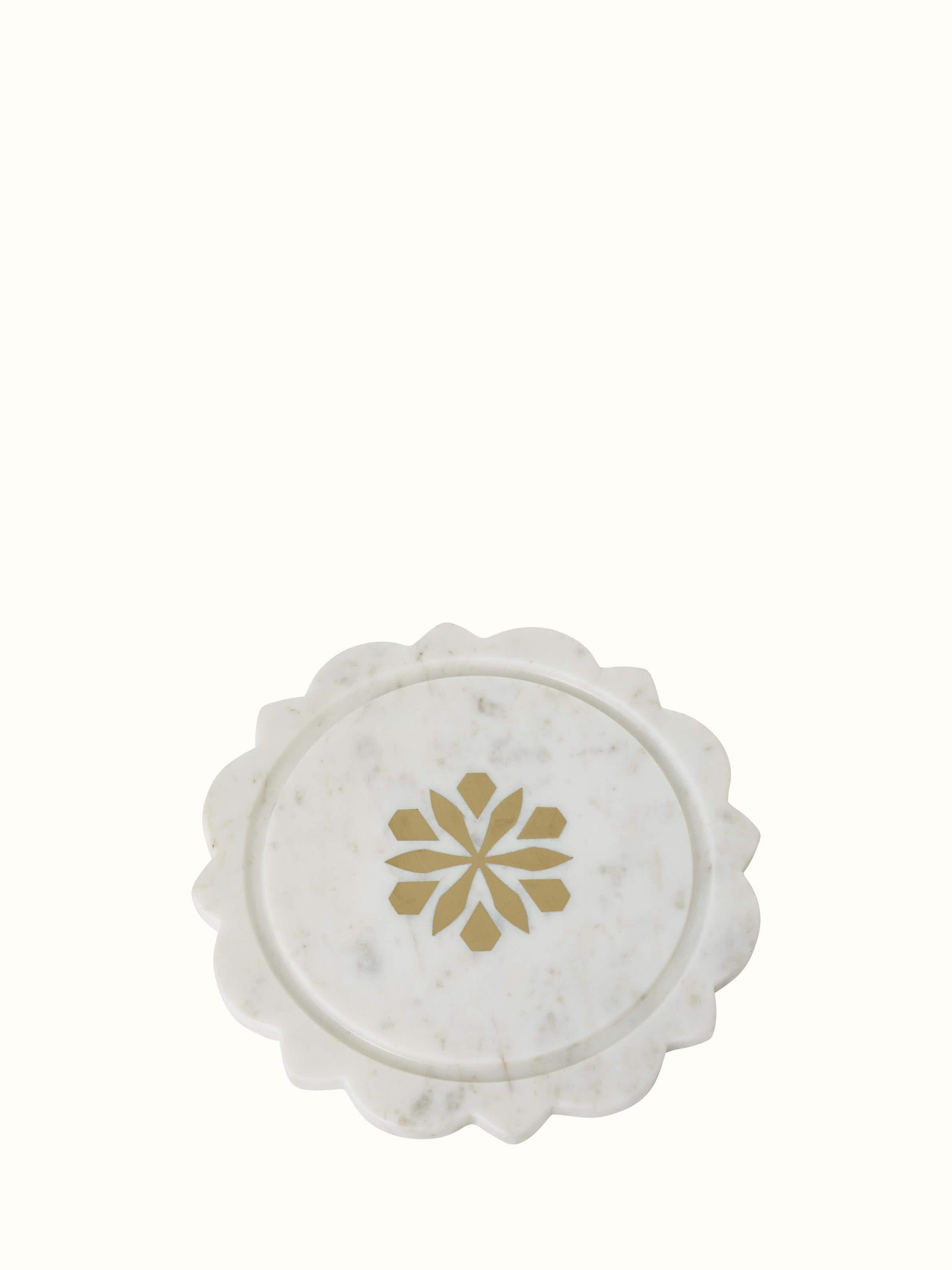 Detailed shot of carved marble and glass cloche highlighting the elegant glass dome