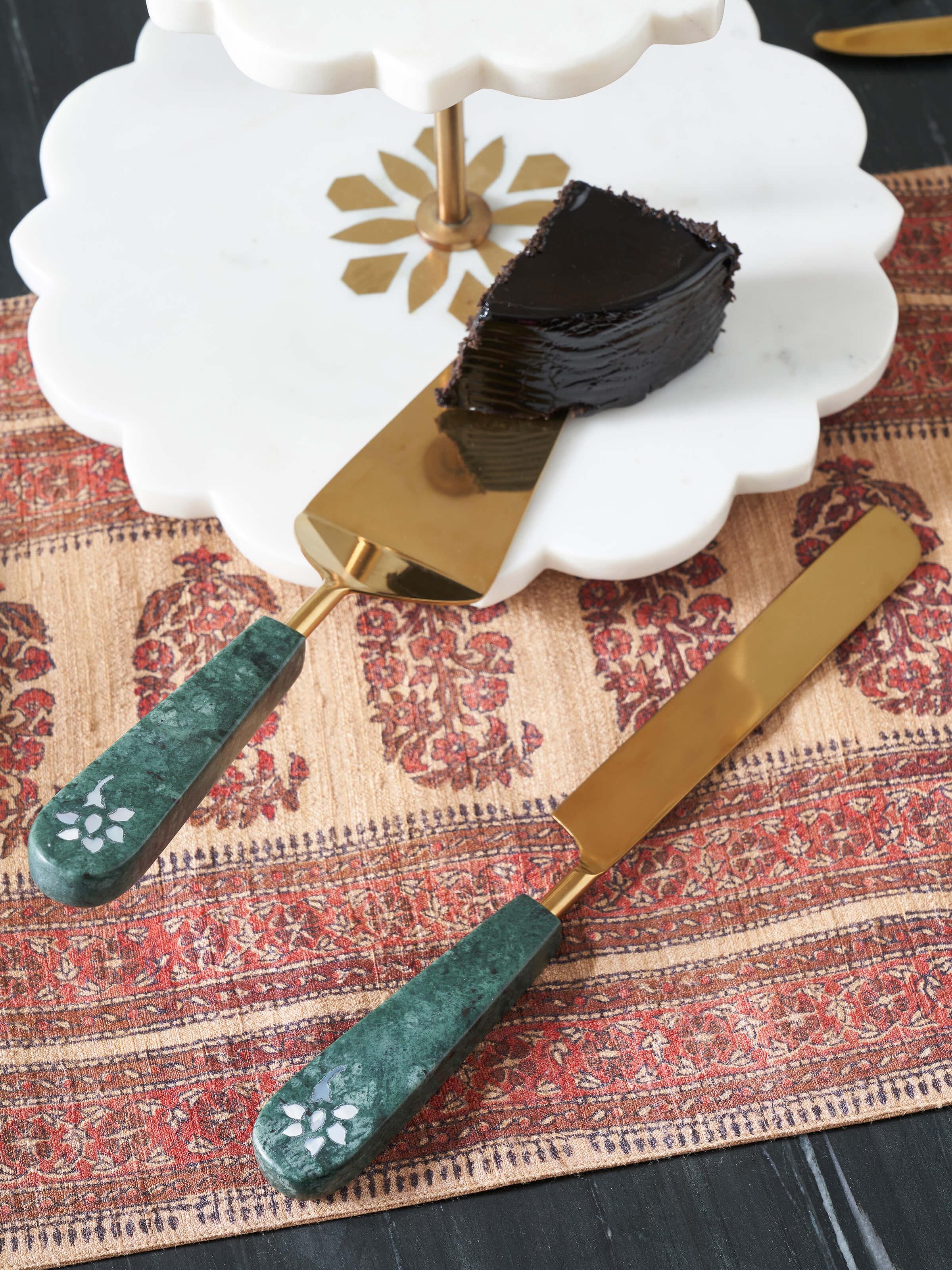 Side view of marble & brass cake servers set of 2, showcasing their high-quality finish
