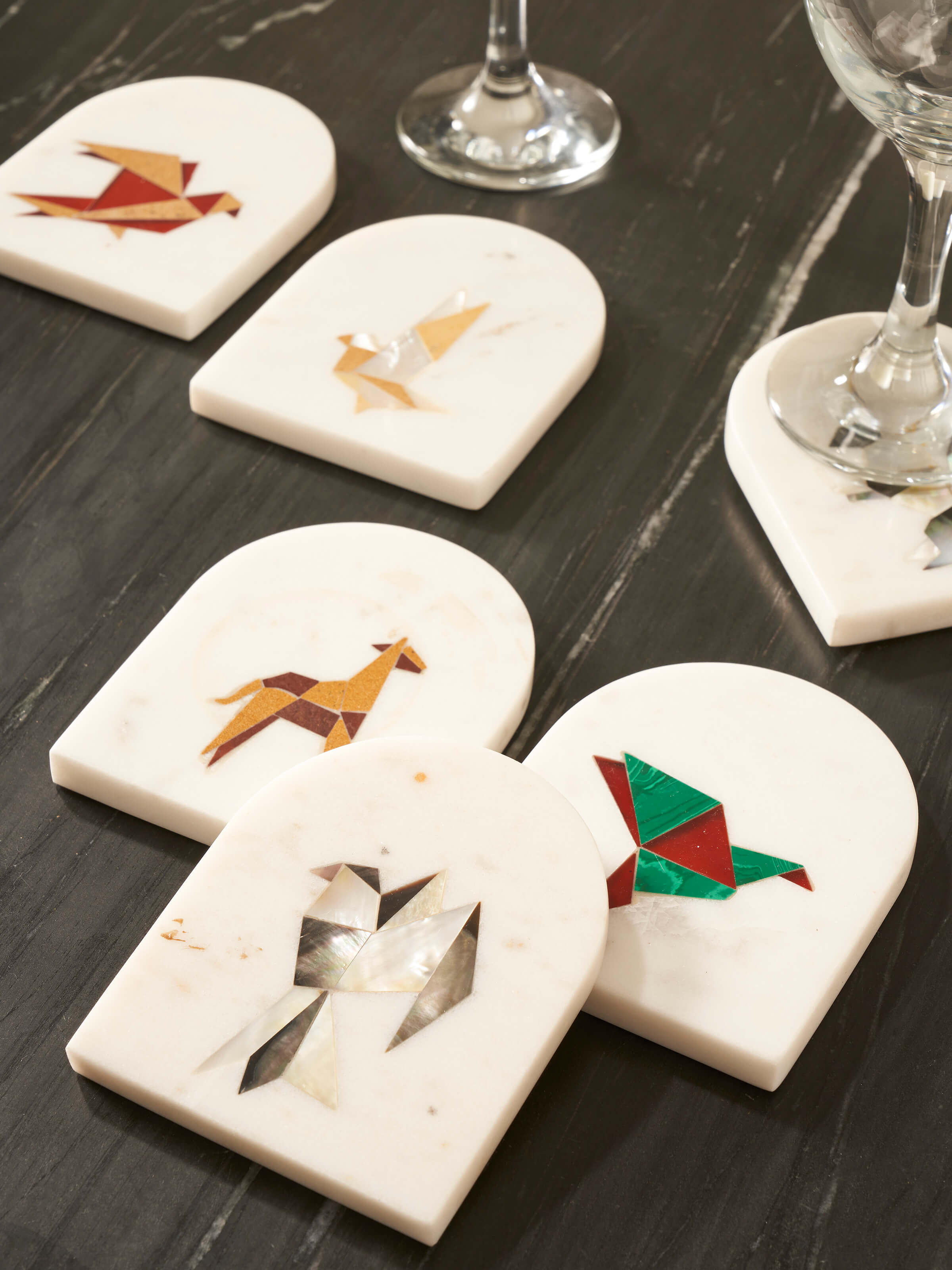 Side view of Carved Marble Coasters (6 pcs) showing the edge and intricate carving of the coasters.