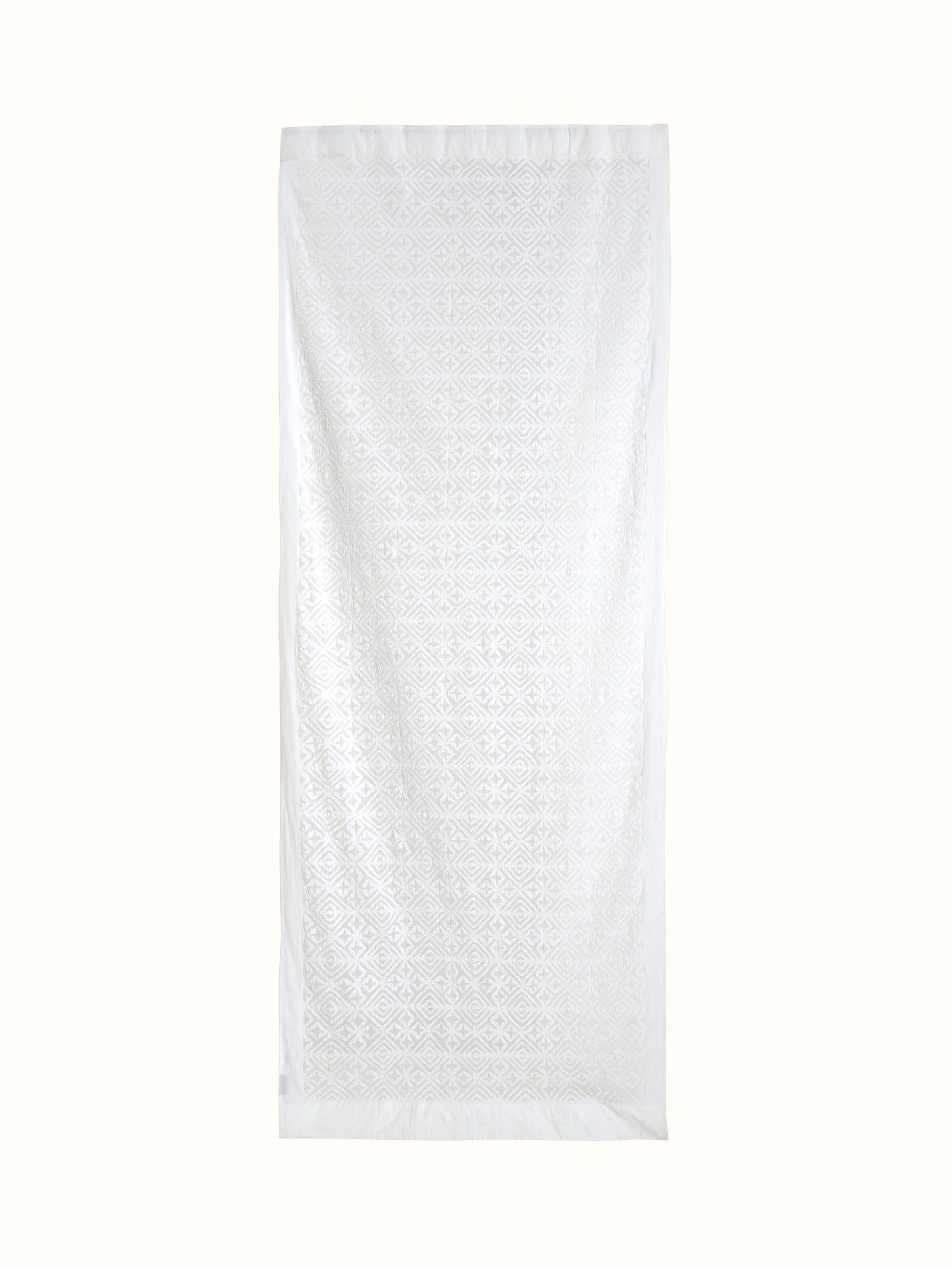 Front view of Mandana White Trellis cotton applique sheer curtain highlighting the intricate design