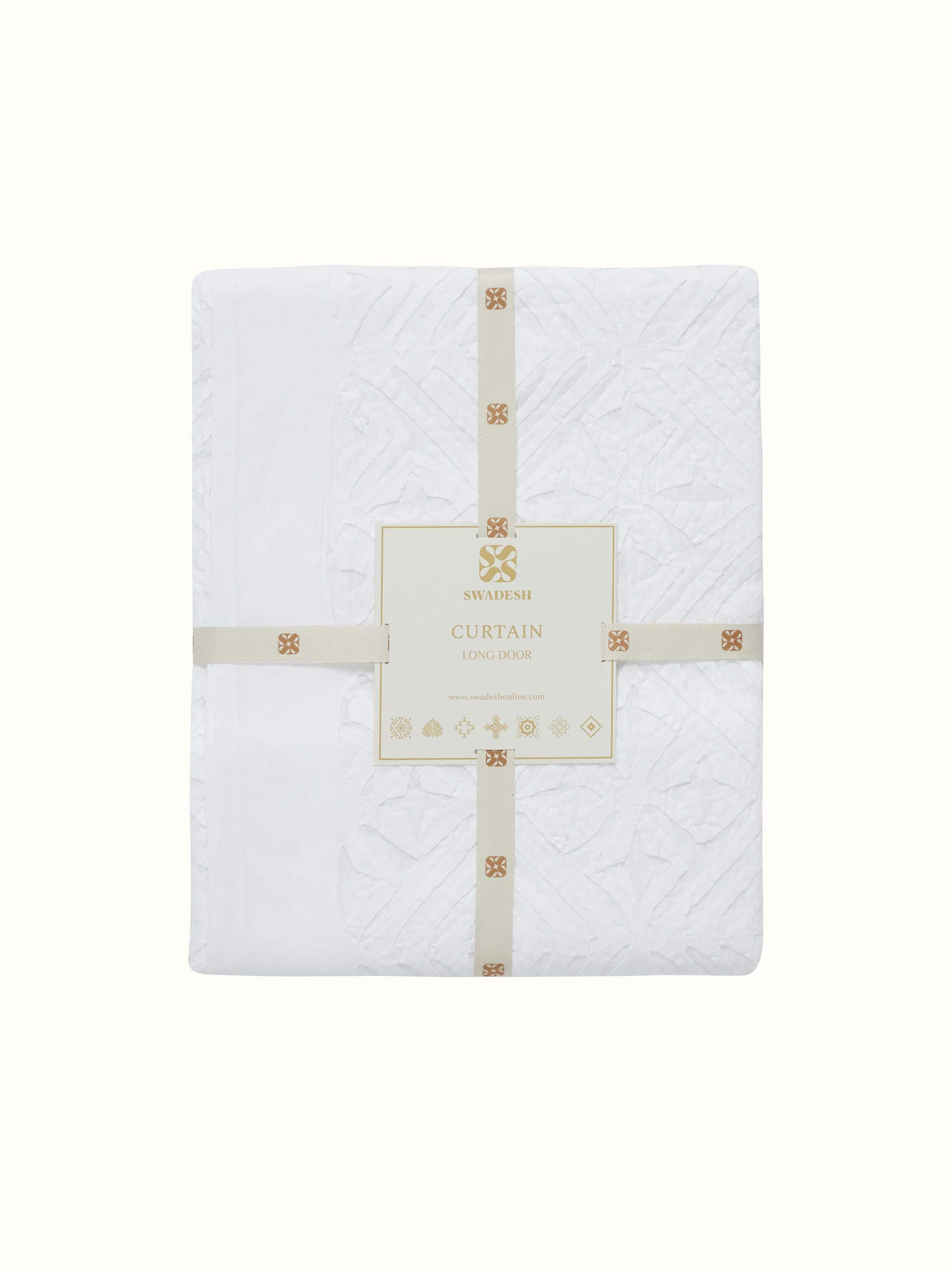 Side view of Mandana White Trellis cotton sheer curtain illustrating the full length and sheer fabric