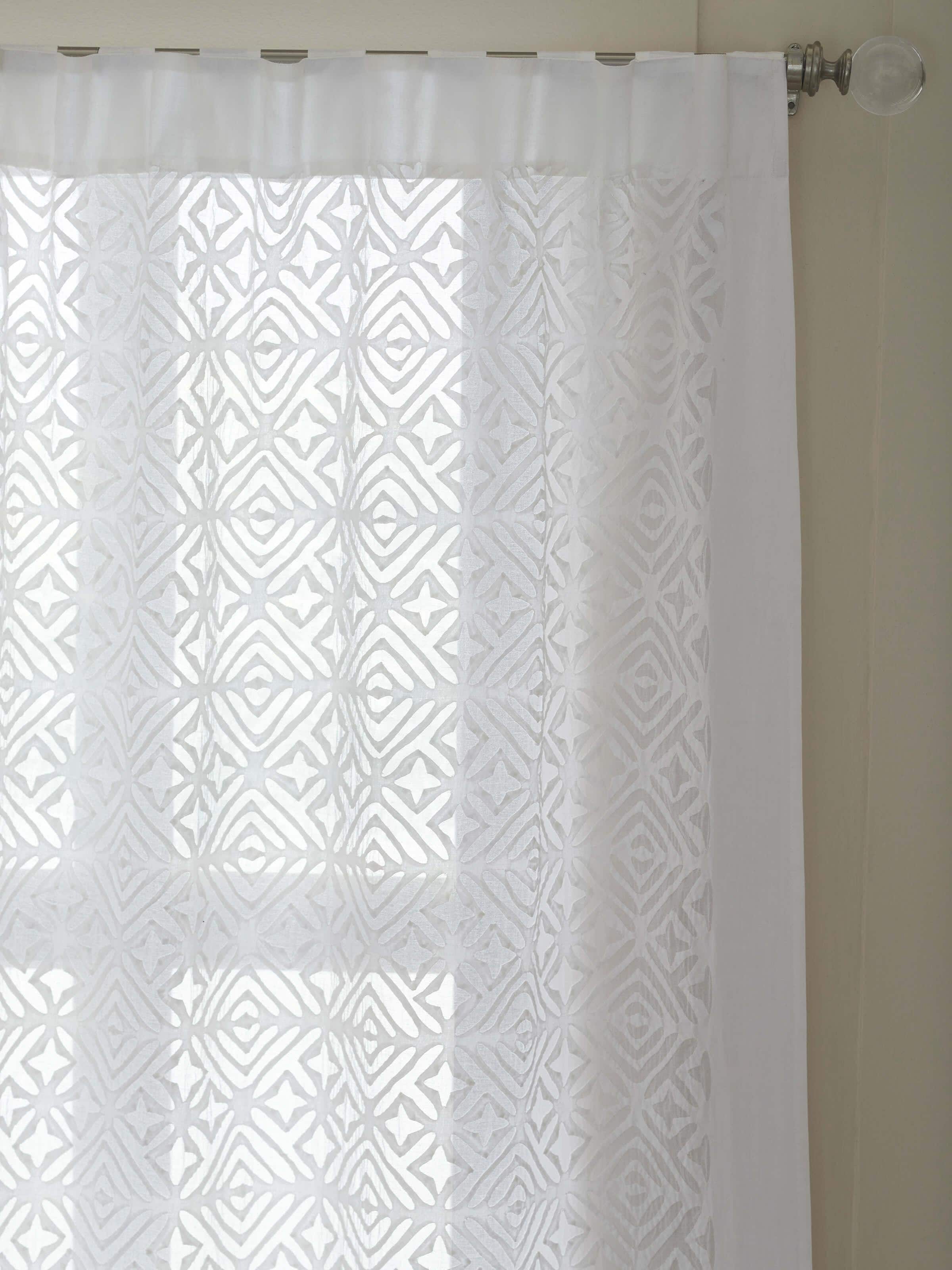 Close-up of Mandana white trellis allover cotton applique sheer curtain highlighting the fabric's sheer quality and trellis pattern