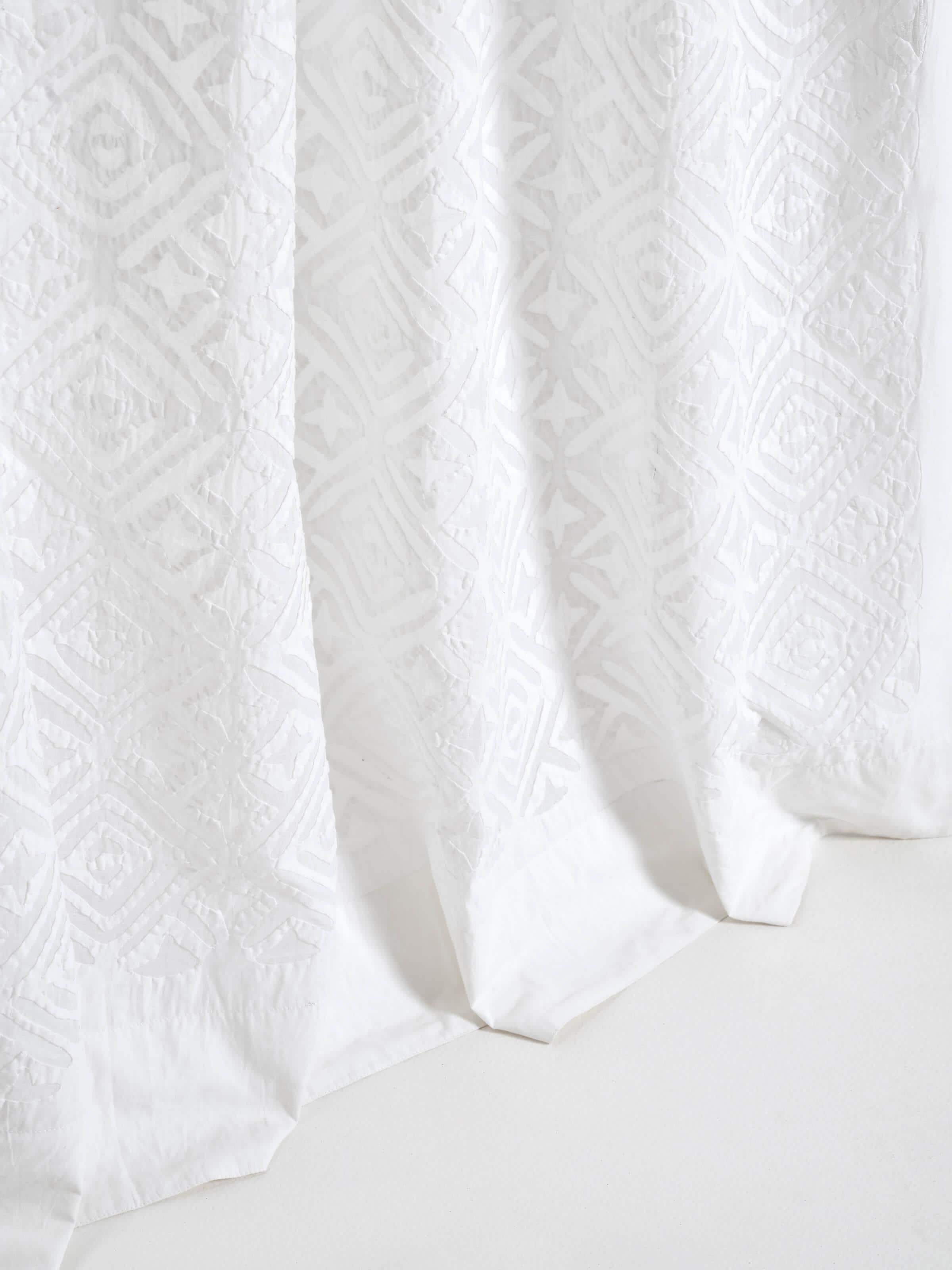 Detail shot of Mandana white trellis allover cotton applique sheer curtain showing the quality of the applique work