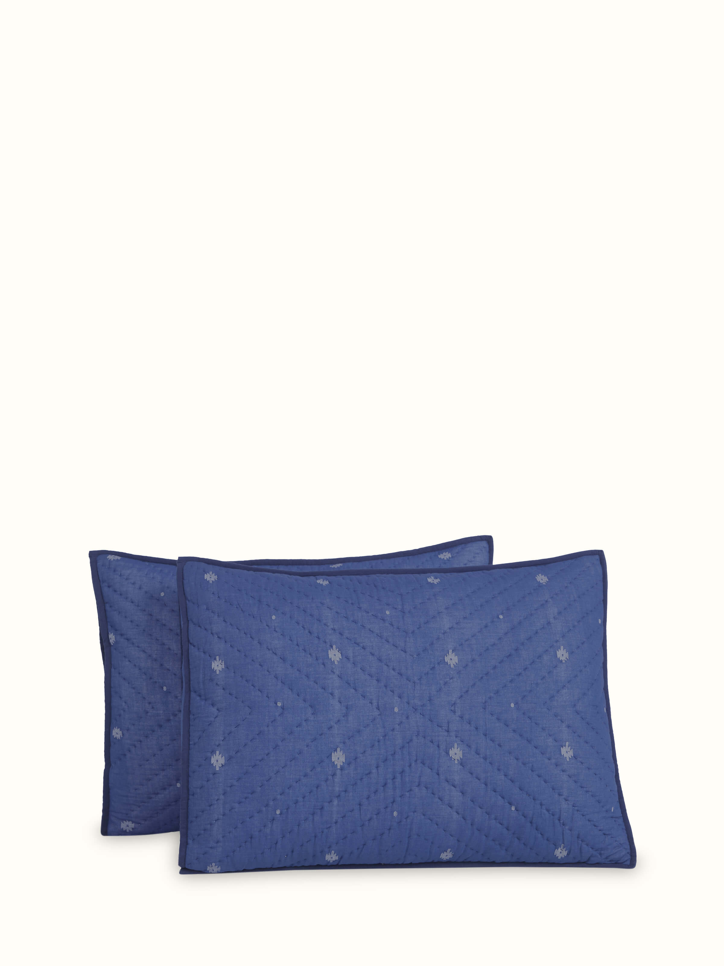 Front view of Kalpanama indigo woven buti cotton pillow shams showing detailed buti pattern and rich indigo color.