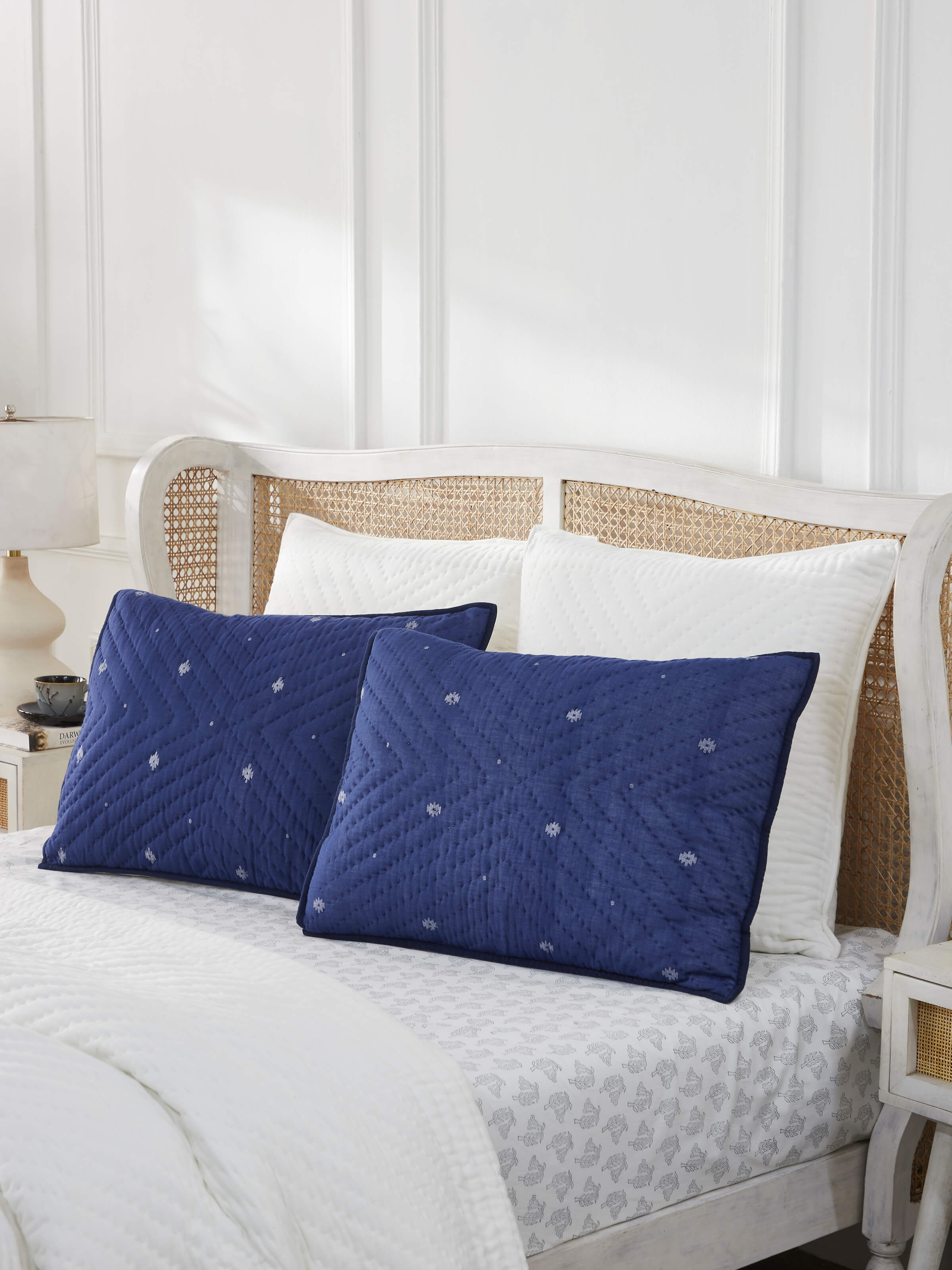 Close-up of Kalpanama indigo woven buti cotton pillow shams highlighting the intricate weaving and classic design.