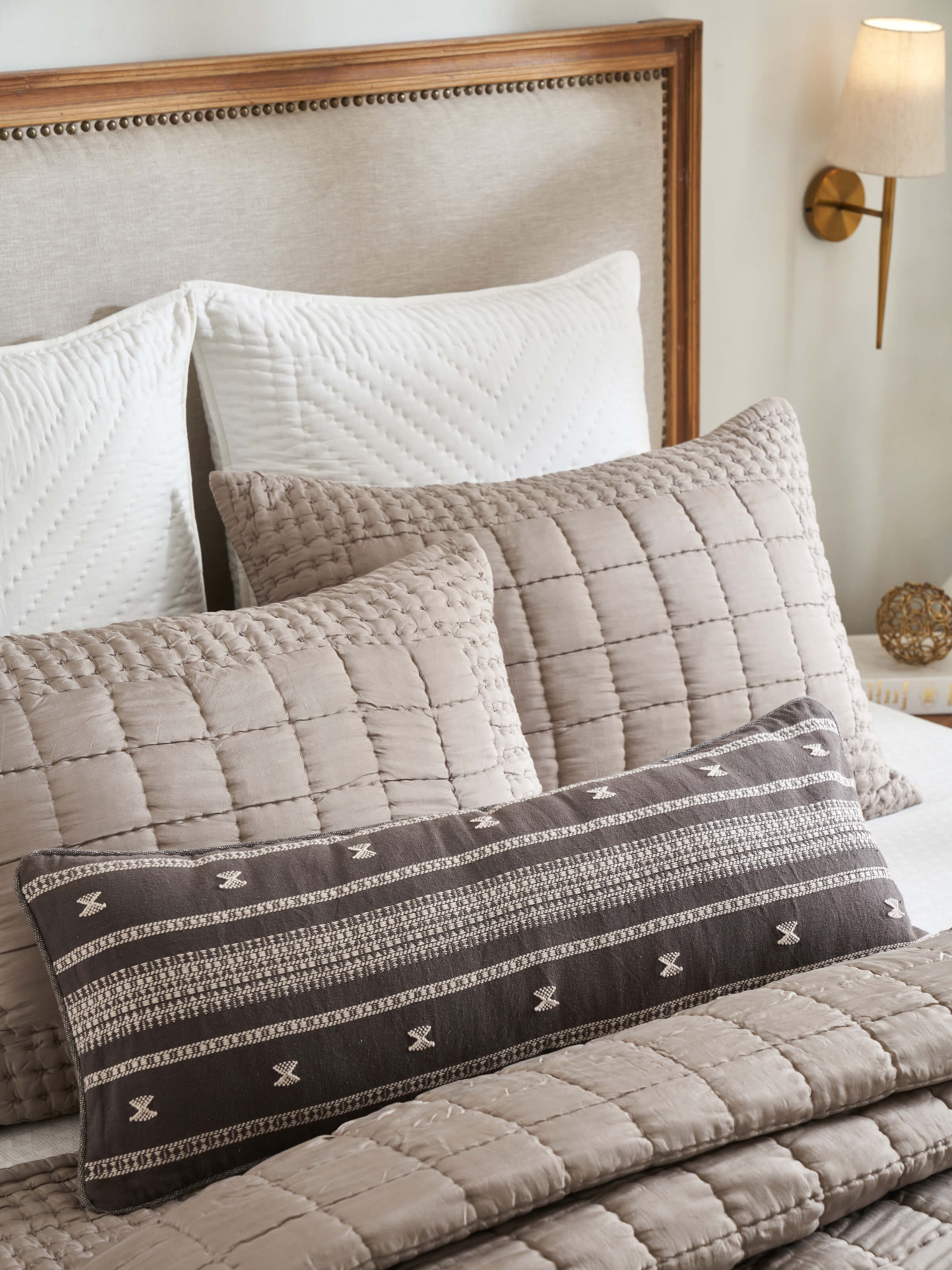 Styled room setup featuring the ethnic Anek coffee handwoven cushion cover.