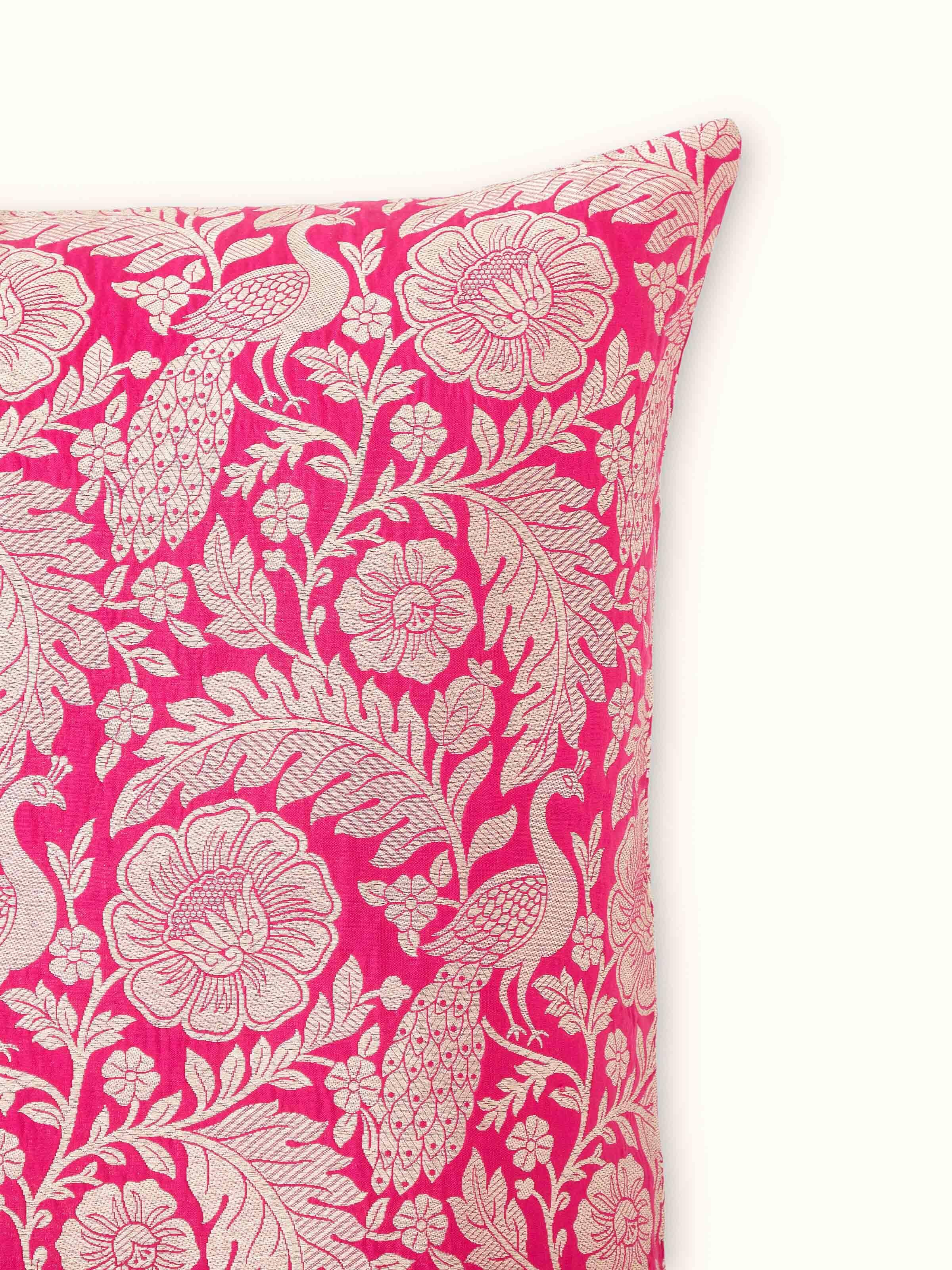 Side view of Avasa raspberry floral silk brocade Banarasi handloom cushion cover capturing the texture and detailing of the fabric.