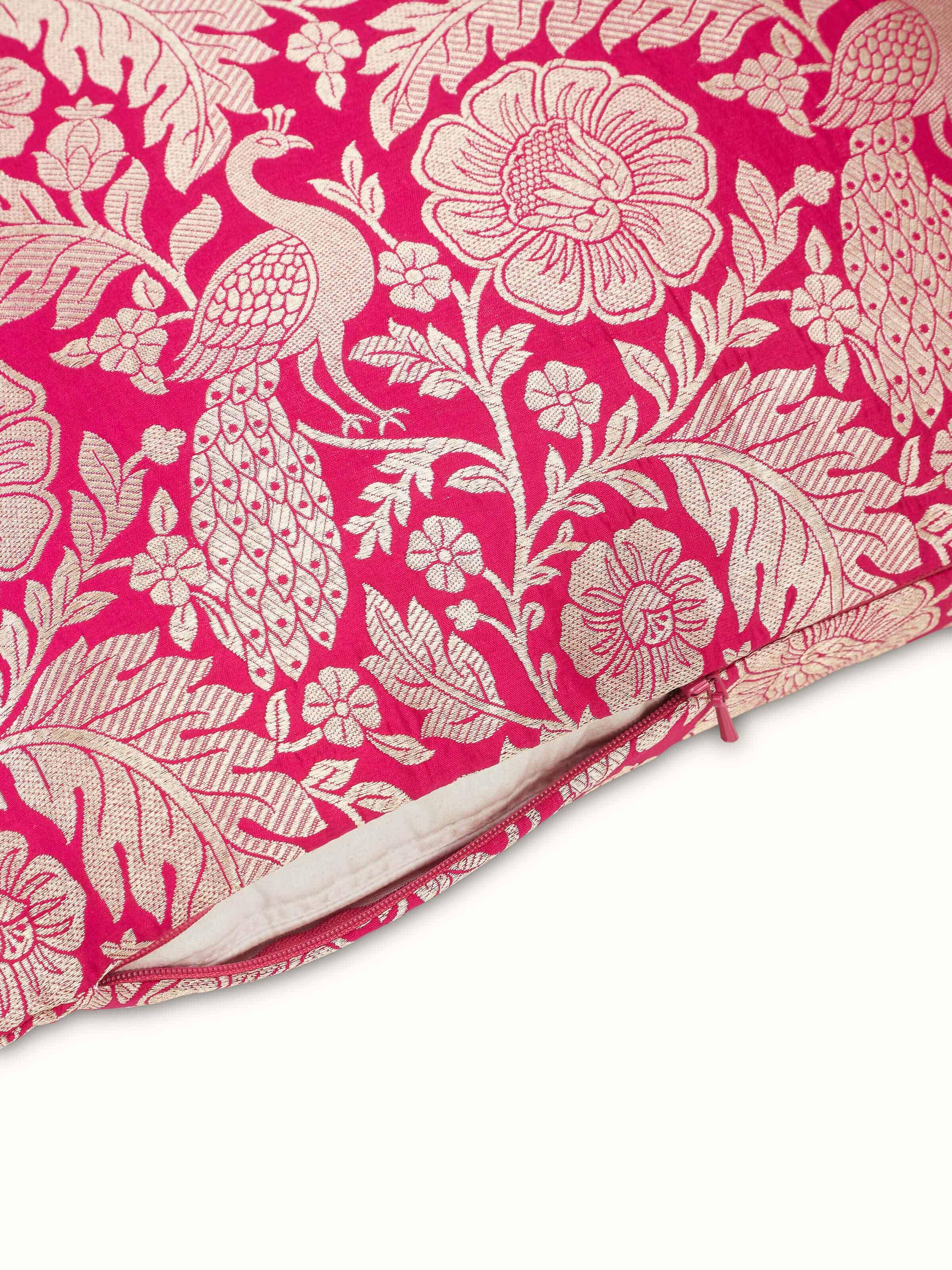 Detailed view of Avasa raspberry floral silk brocade Banarasi handloom cushion cover highlighting the craftsmanship and design elements.