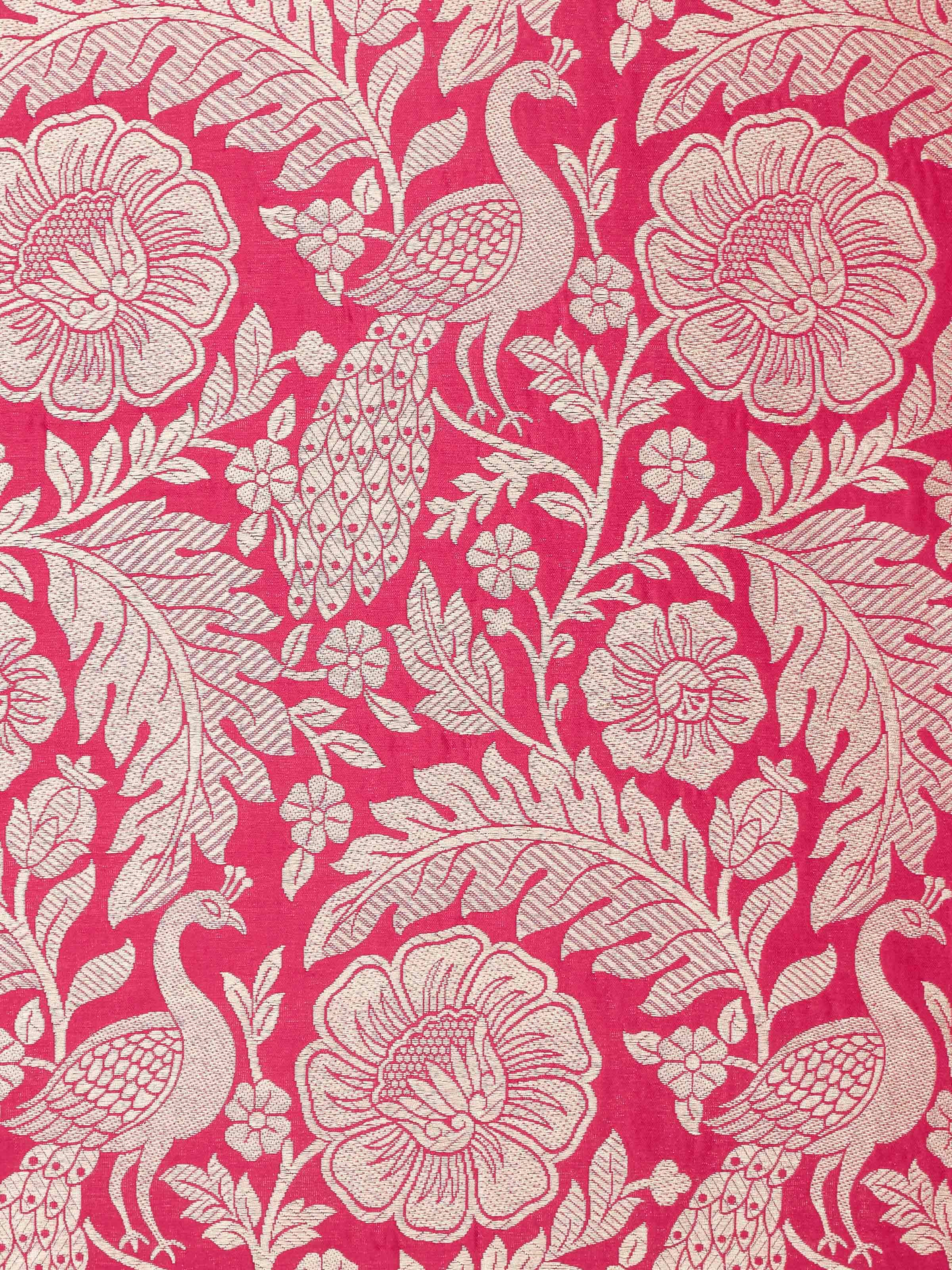 Perspective view of Avasa raspberry floral silk brocade Banarasi handloom cushion cover showcasing its elegant design and rich texture.