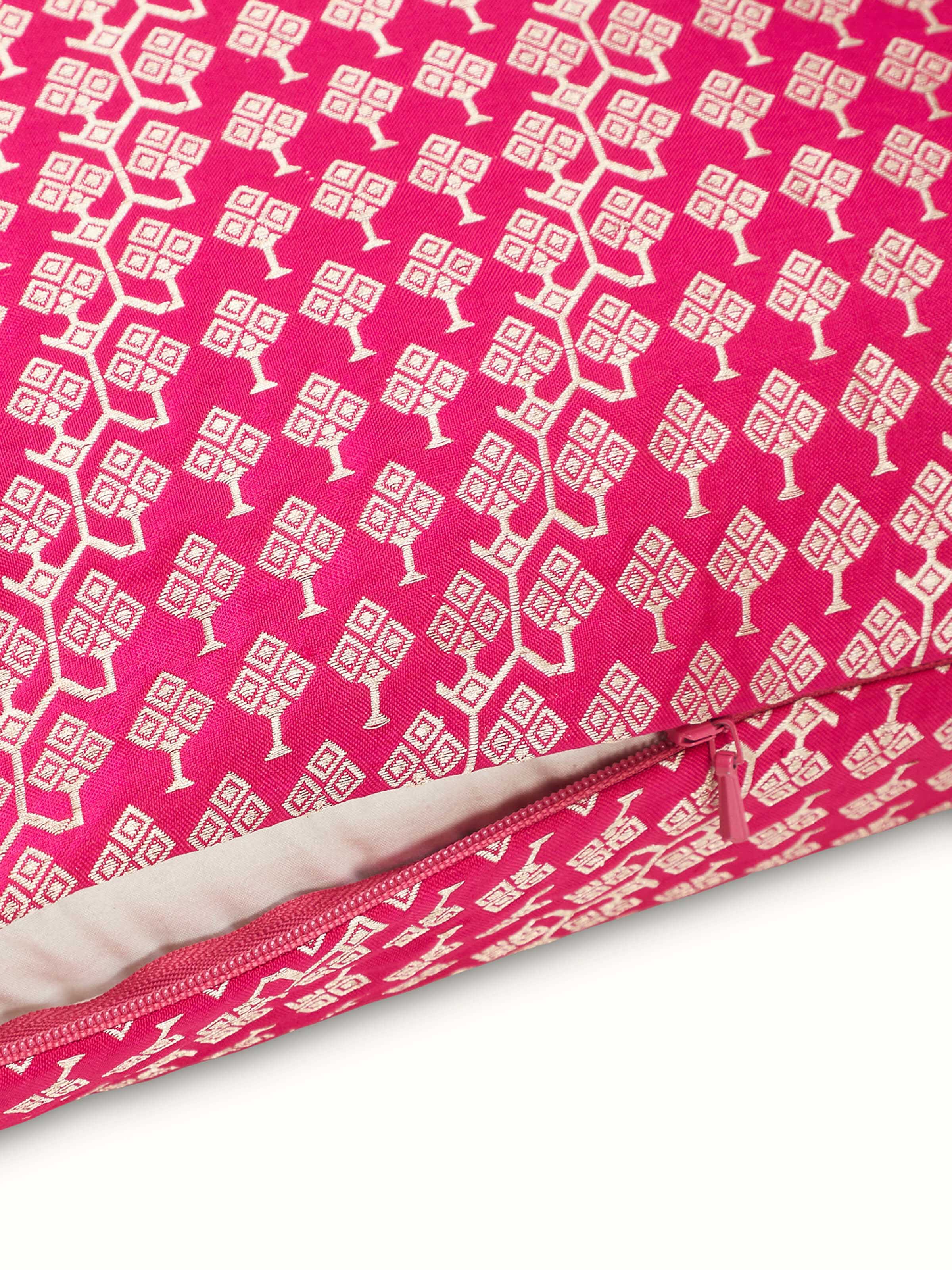 Close-up highlighting shimmering silk texture and traditional Banarasi weave on Avasa cushion