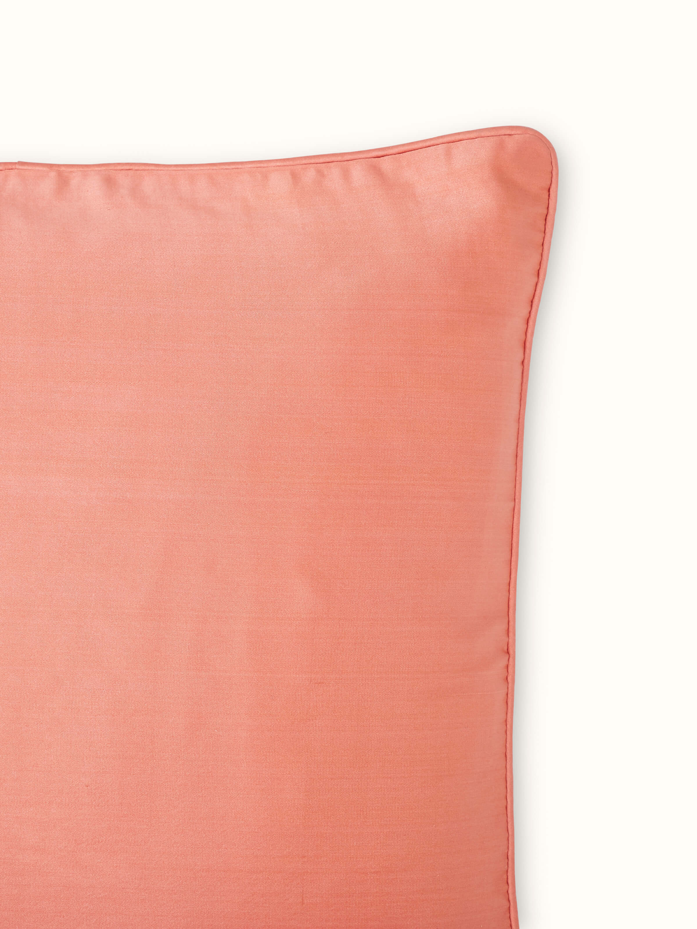 Detailed view of Malya Peach Banarasi Handloom Cushion Cover accentuating the elegant silk satin material