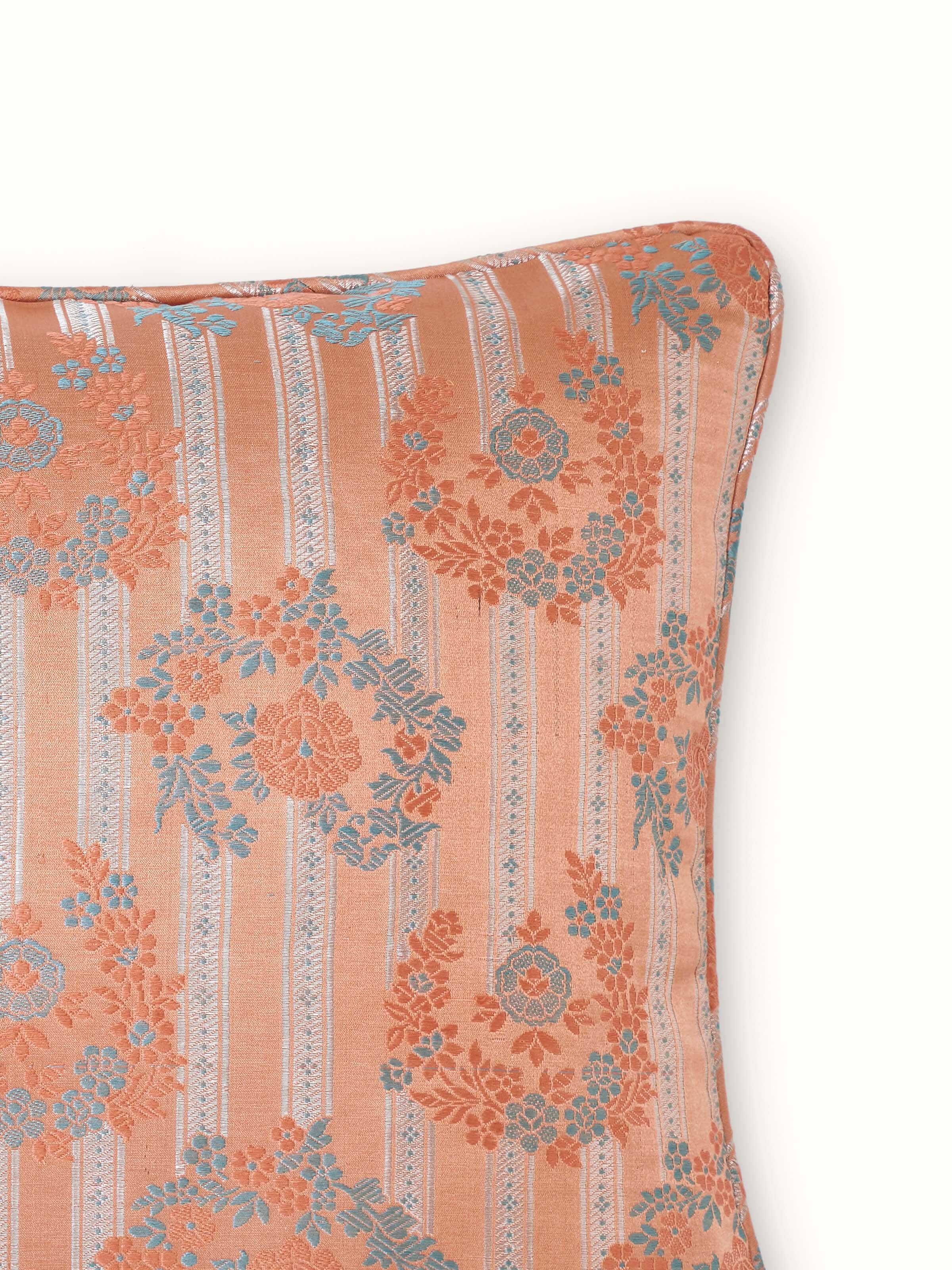 Detail shot of Banarasi lumbar cushion cover highlighting brocade motifs and silk sheen